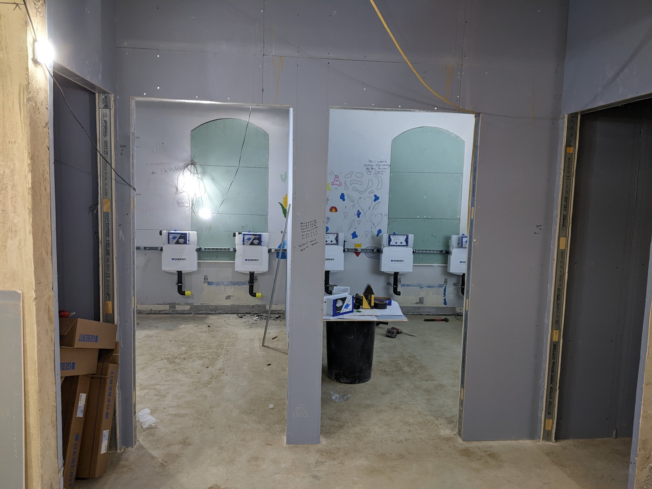First fix for the new ground floor toilets in the old youth room; windows boarded up