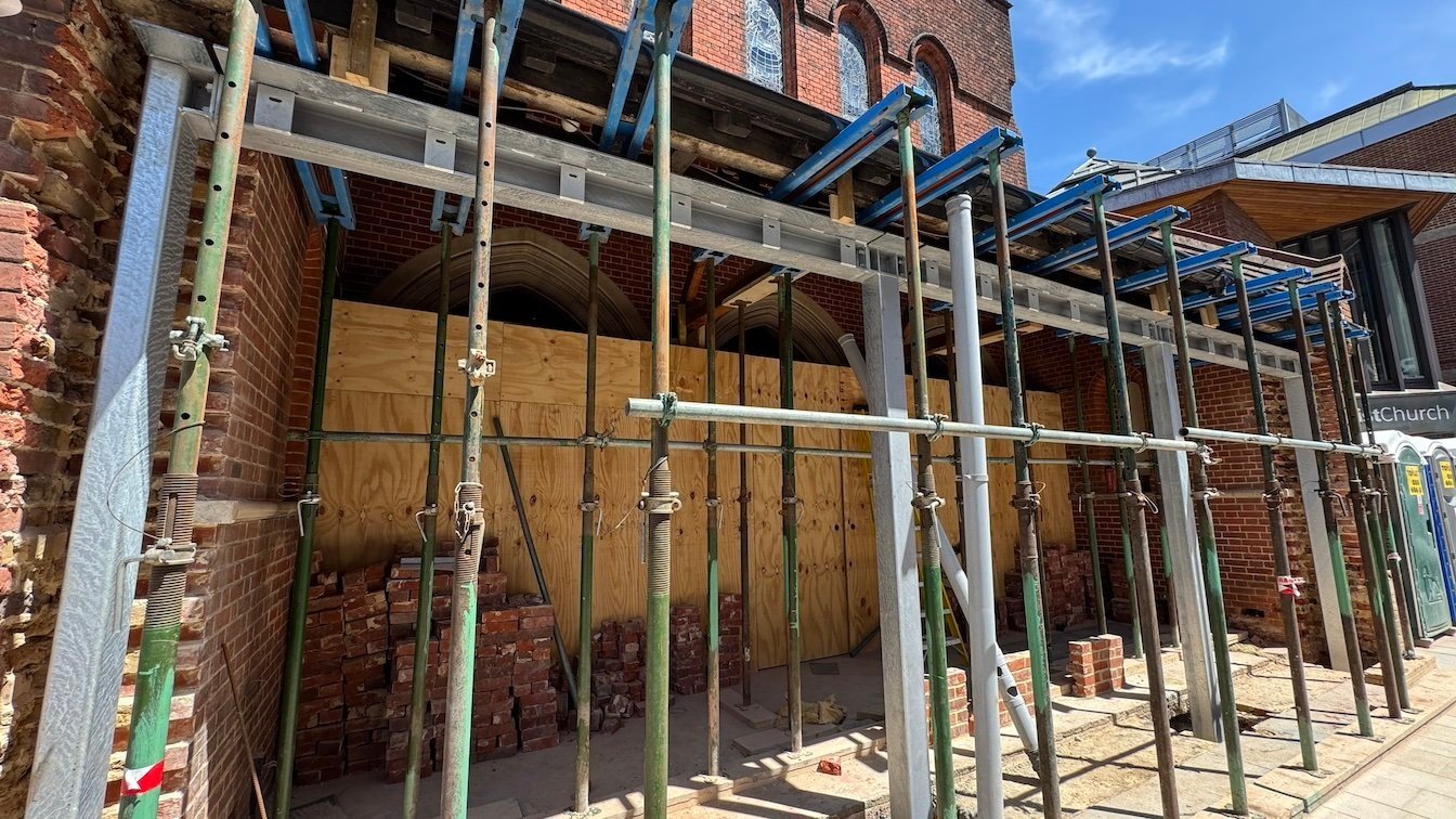 Narthex wall down, new beam in and awaiting new windows