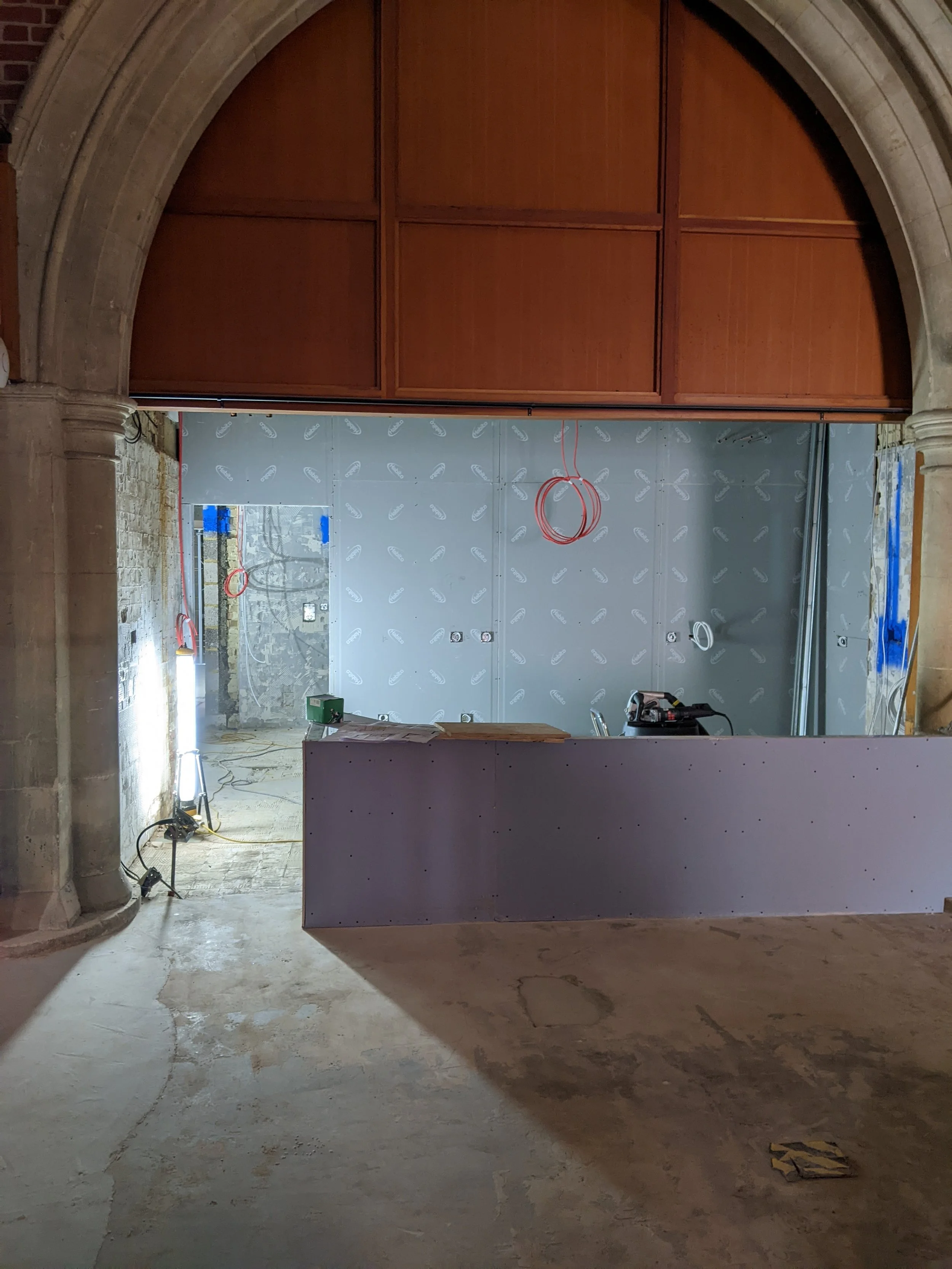 New café serving counter in place, plus the wall behind it