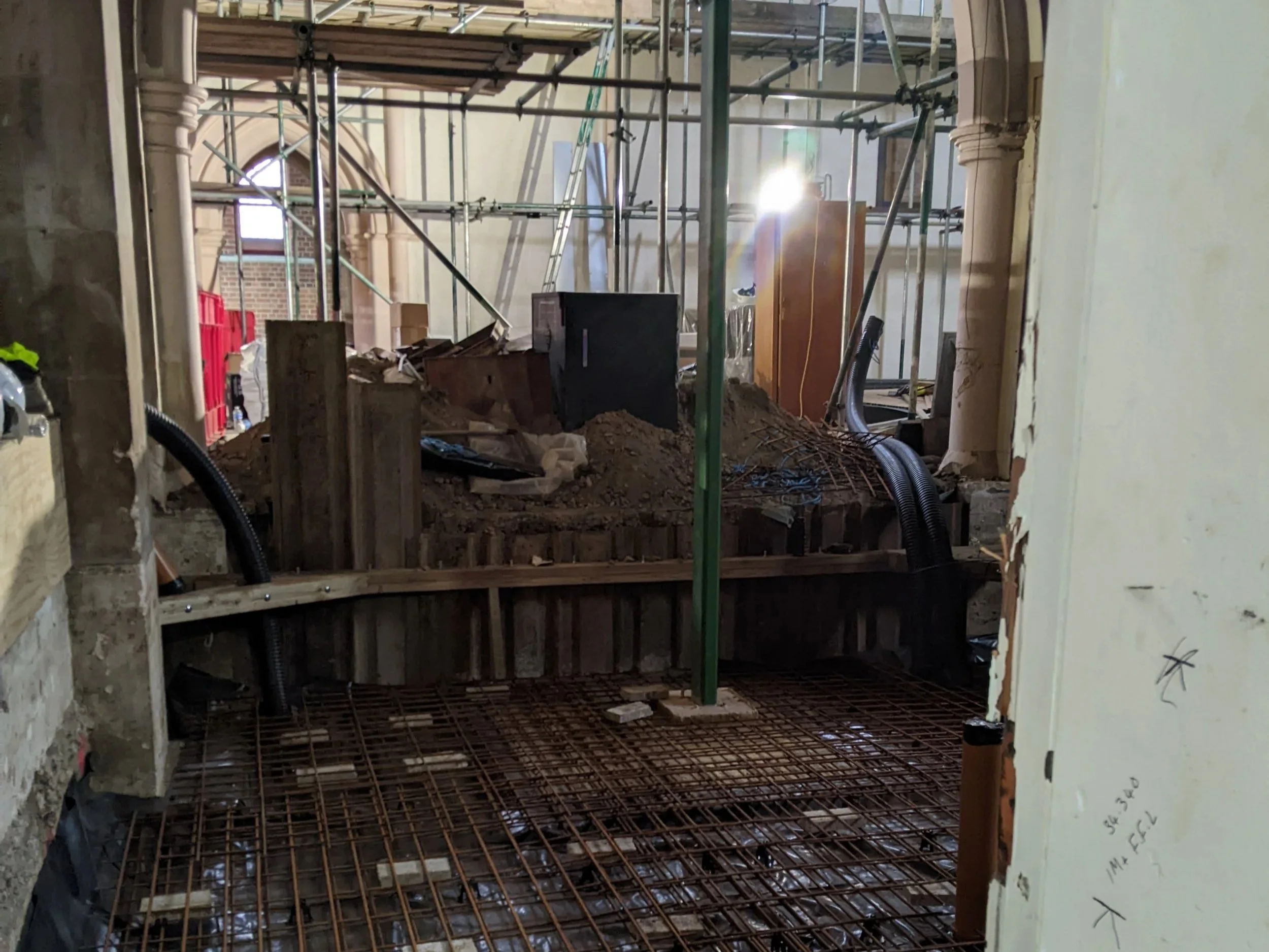Looking down on the lowered floor reinforcements for the new Youth &amp; Community Centre