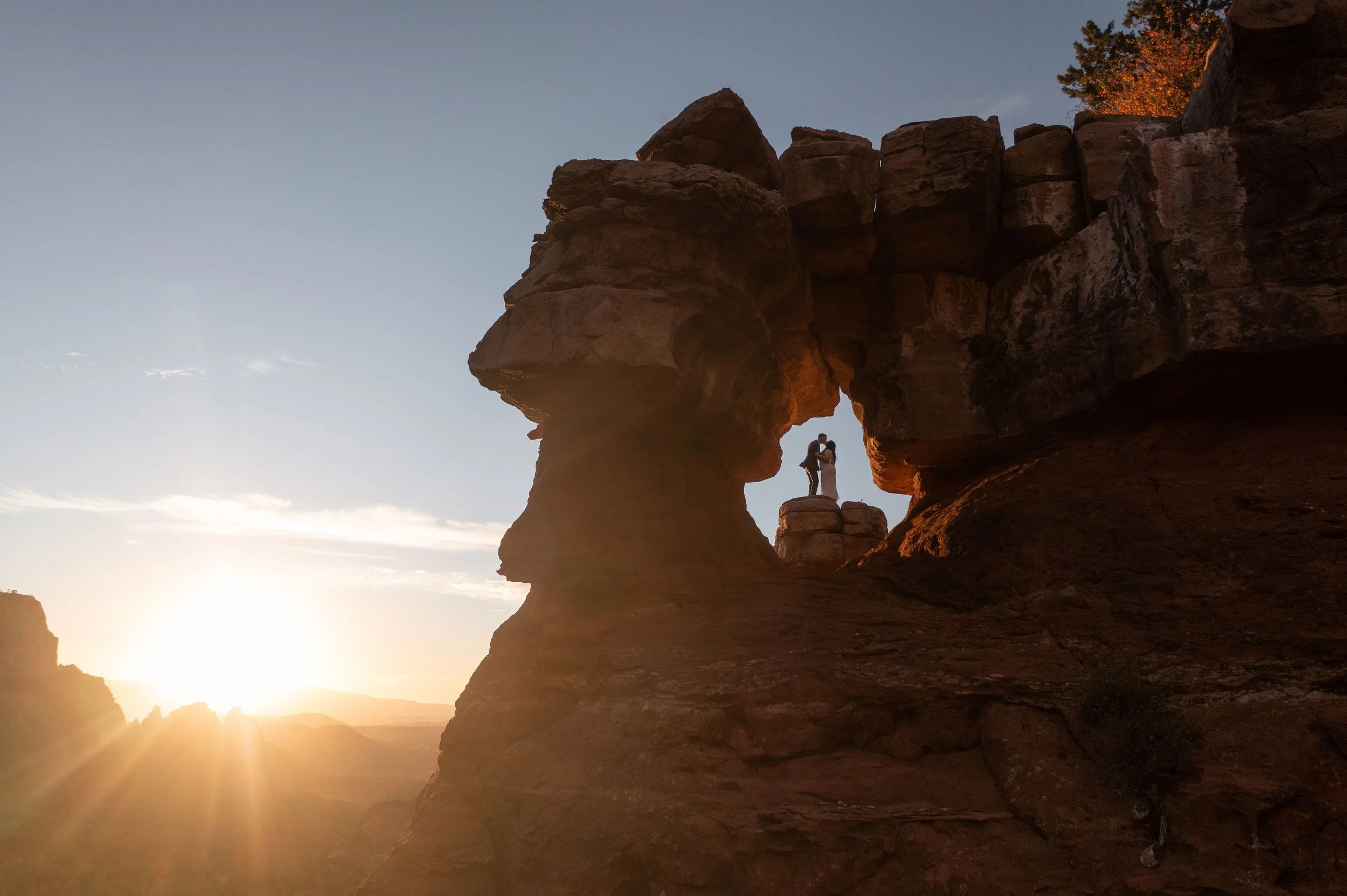 couple kissing in merry go round by Sedona elopement photographer Nick Patton