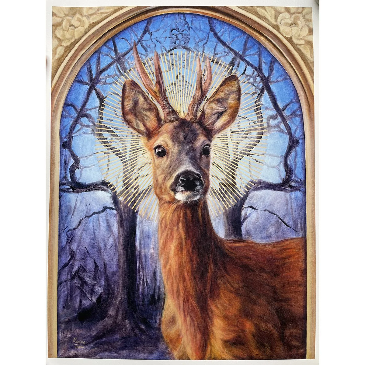 A giclee print of a roe deer buck with a sunburst halo against a background of mirrored winter trees. Available to buy. By imaginative realism artist Karina Tarin