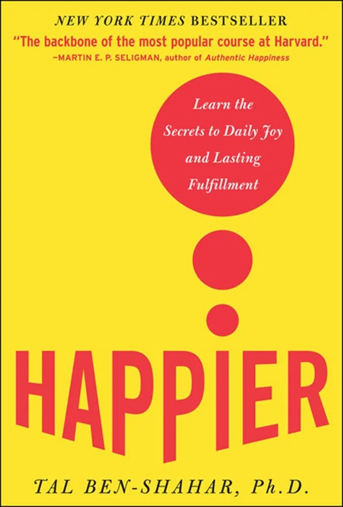 Book cover for 'Happier' by Tal Ben-Shahar, Ph.D., with bright yellow background, large red title and red circles, including a red circle with white text about learning secrets to daily joy and fulfillment, and a quote praising Harvard's popular course.