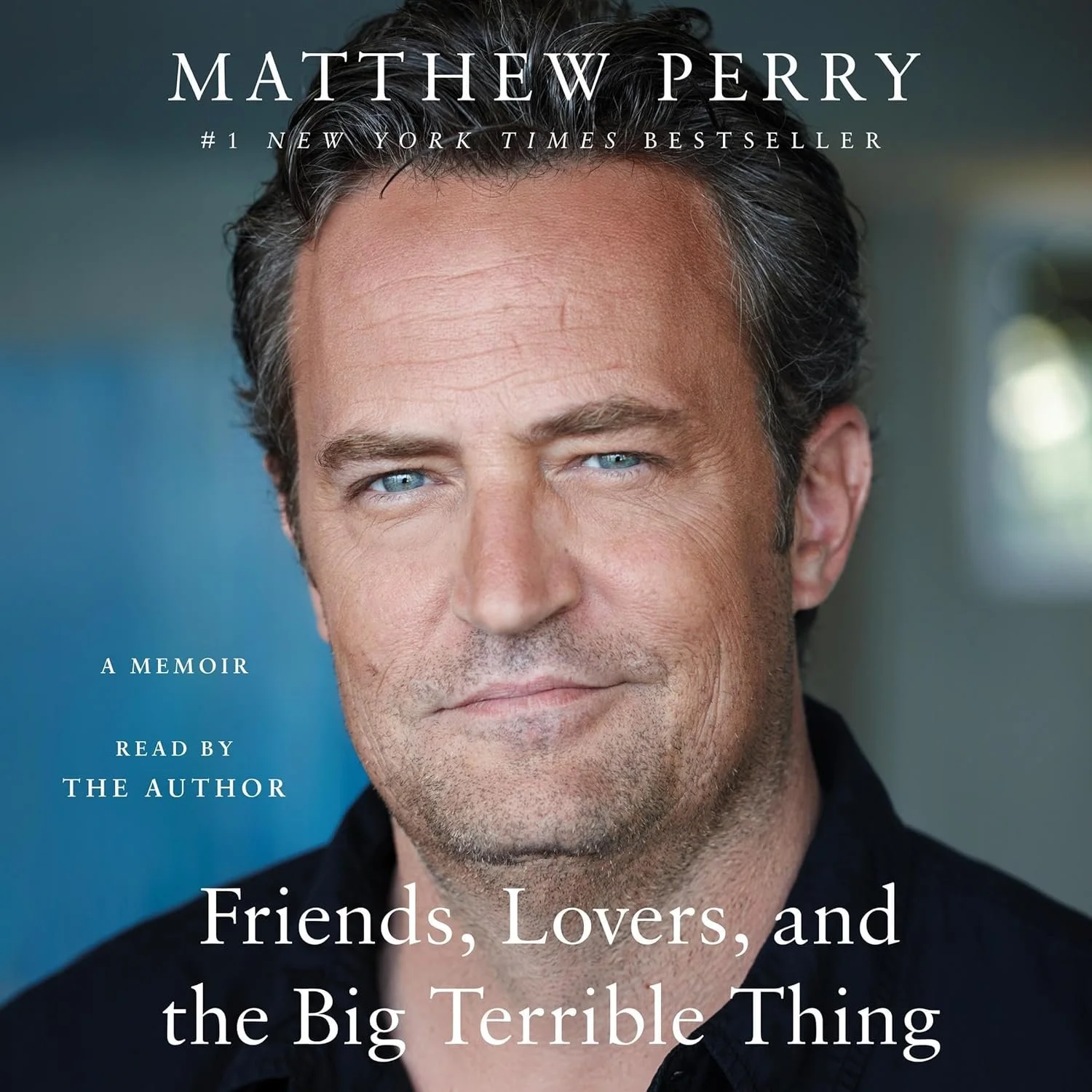 Book cover of Matthew Perry's memoir titled "Friends, Lovers, and the Big Terrible Thing," featuring a close-up portrait of Matthew Perry with blue eyes and dark hair. The cover includes text indicating it is a New York Times bestseller and read by the author.