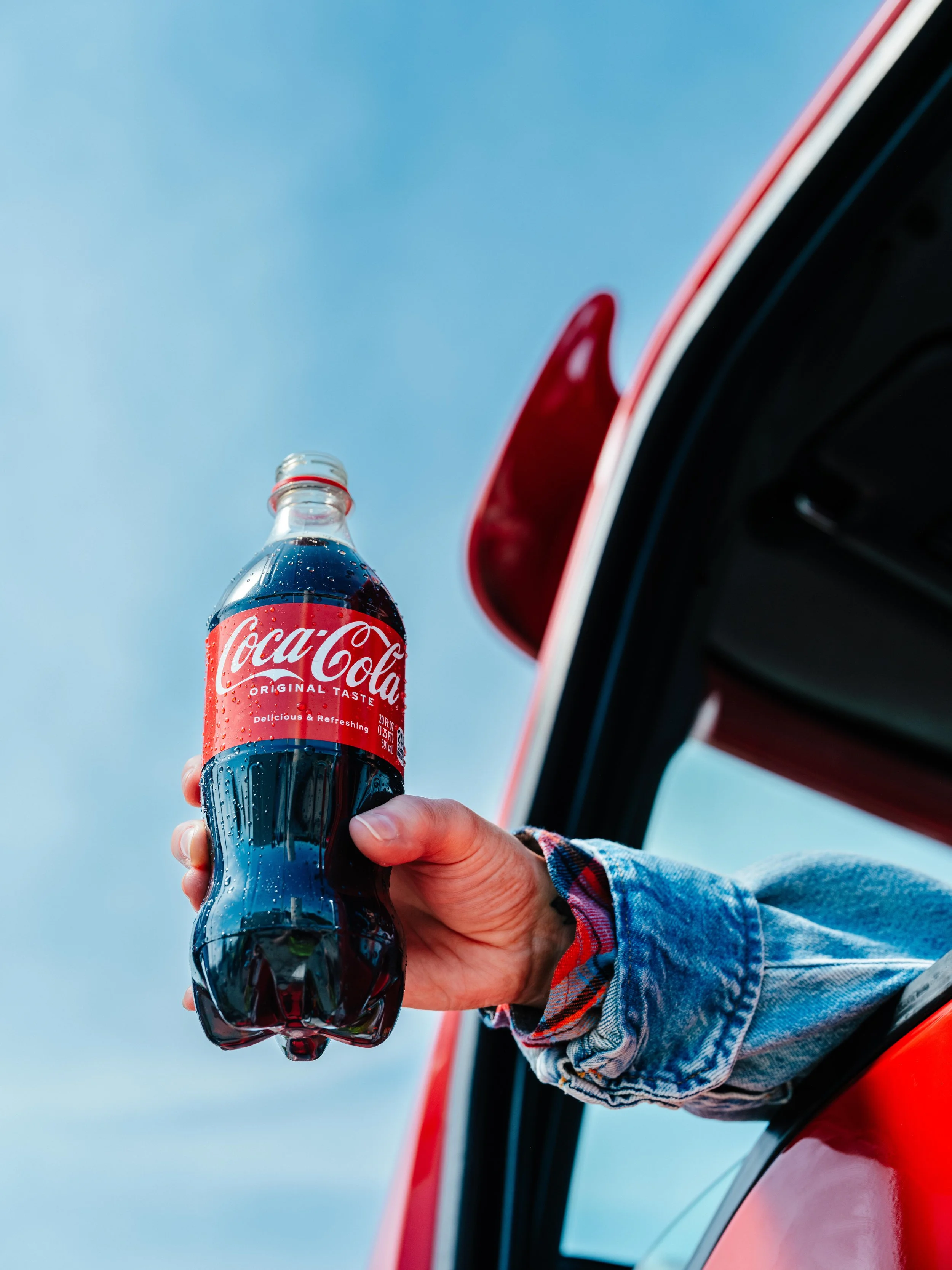 05112026_PILOT_DRIVER APPRECIATION_DRIVER HOLDING DRINK OUT OF WINDOW_COCACOLA_02671.jpg