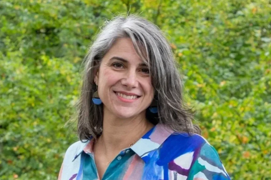 photo of a smiling salt and pepper grey haired womanMarjorie Maffett