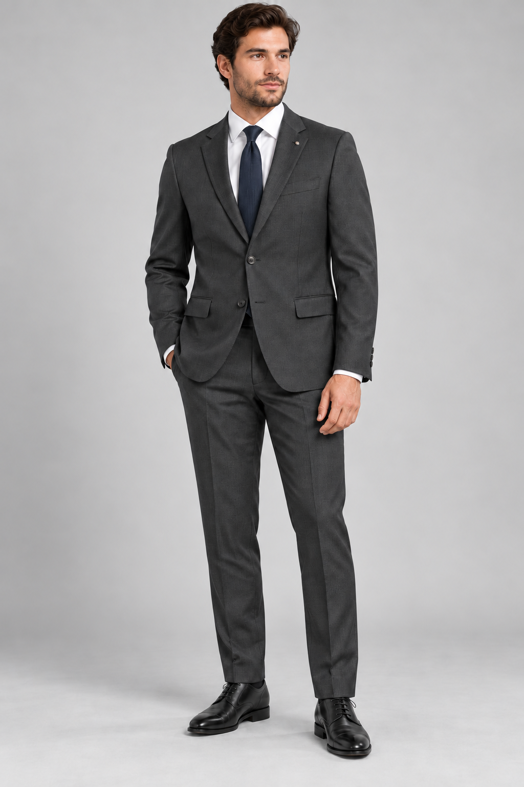 Neutral charcoal suit studio visualization.png