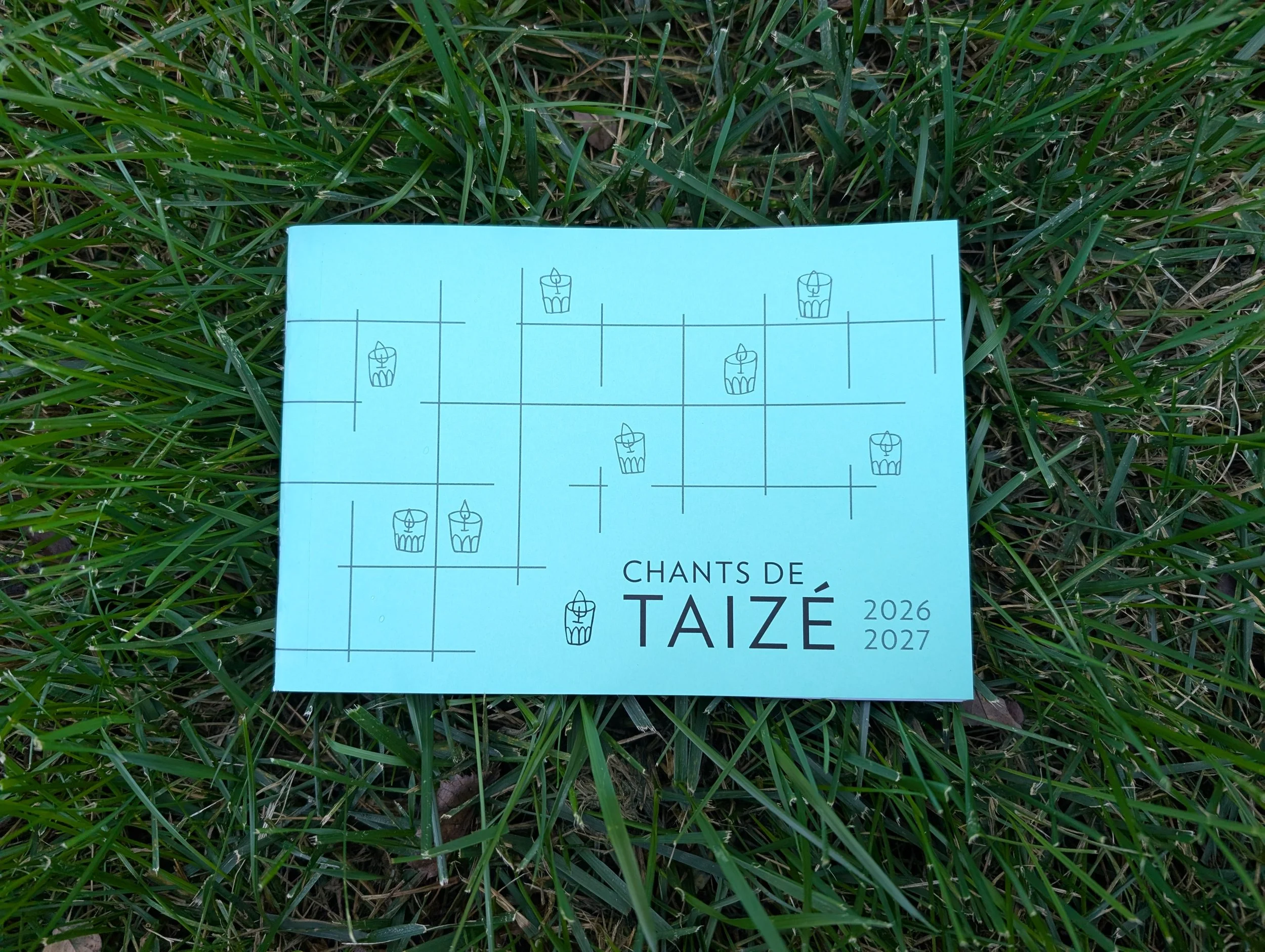 Taize songbook in grass