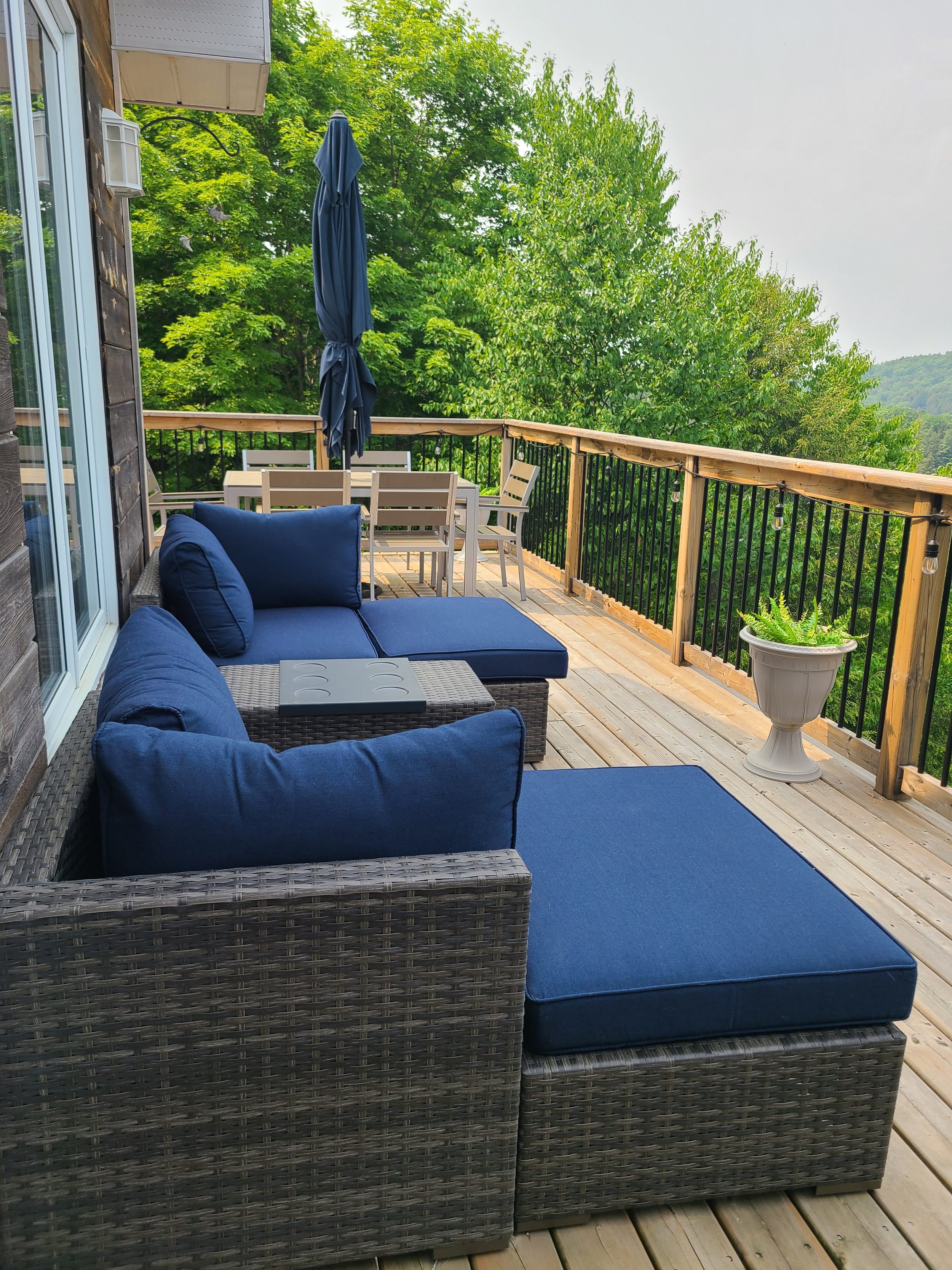 Outdoor seating area on the upper deck at Kennisis Lake Cottage, offering breathtaking elevated views of the lake—perfect for morning coffee or sunset relaxation.
