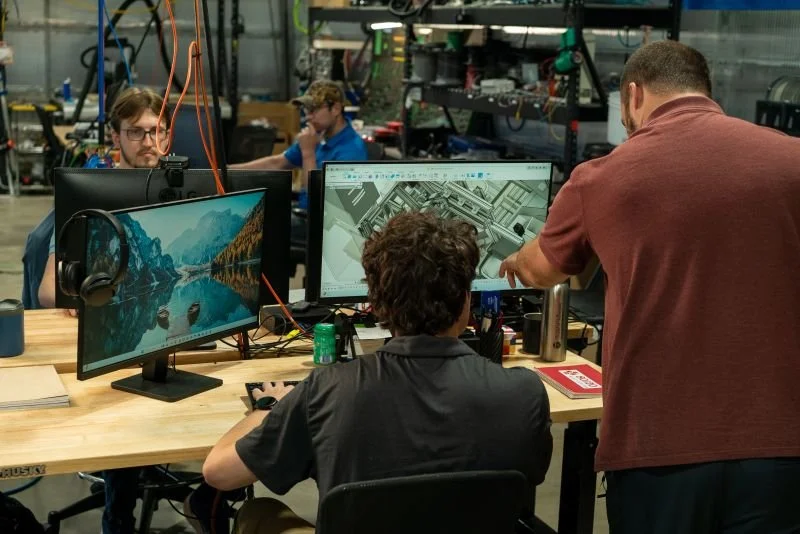 Four Better Process LLC Engineers working at desks