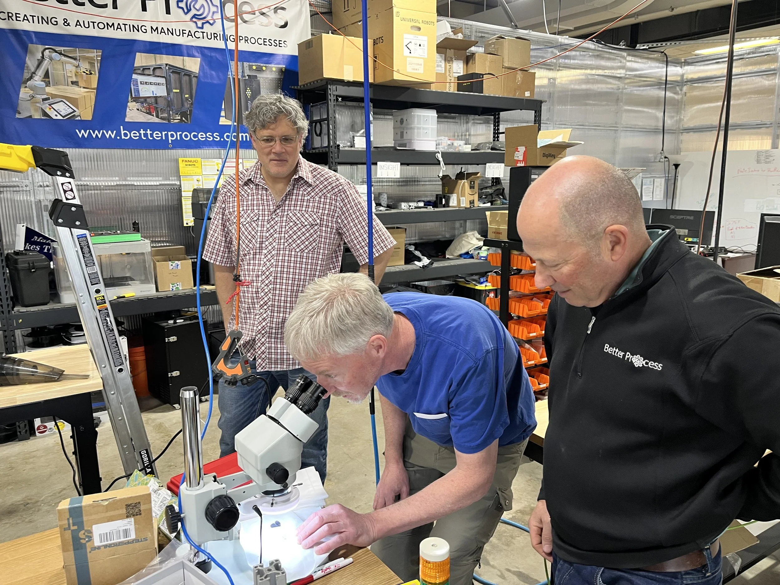 Three Warehouse Innovation Hub members collaborating on a project