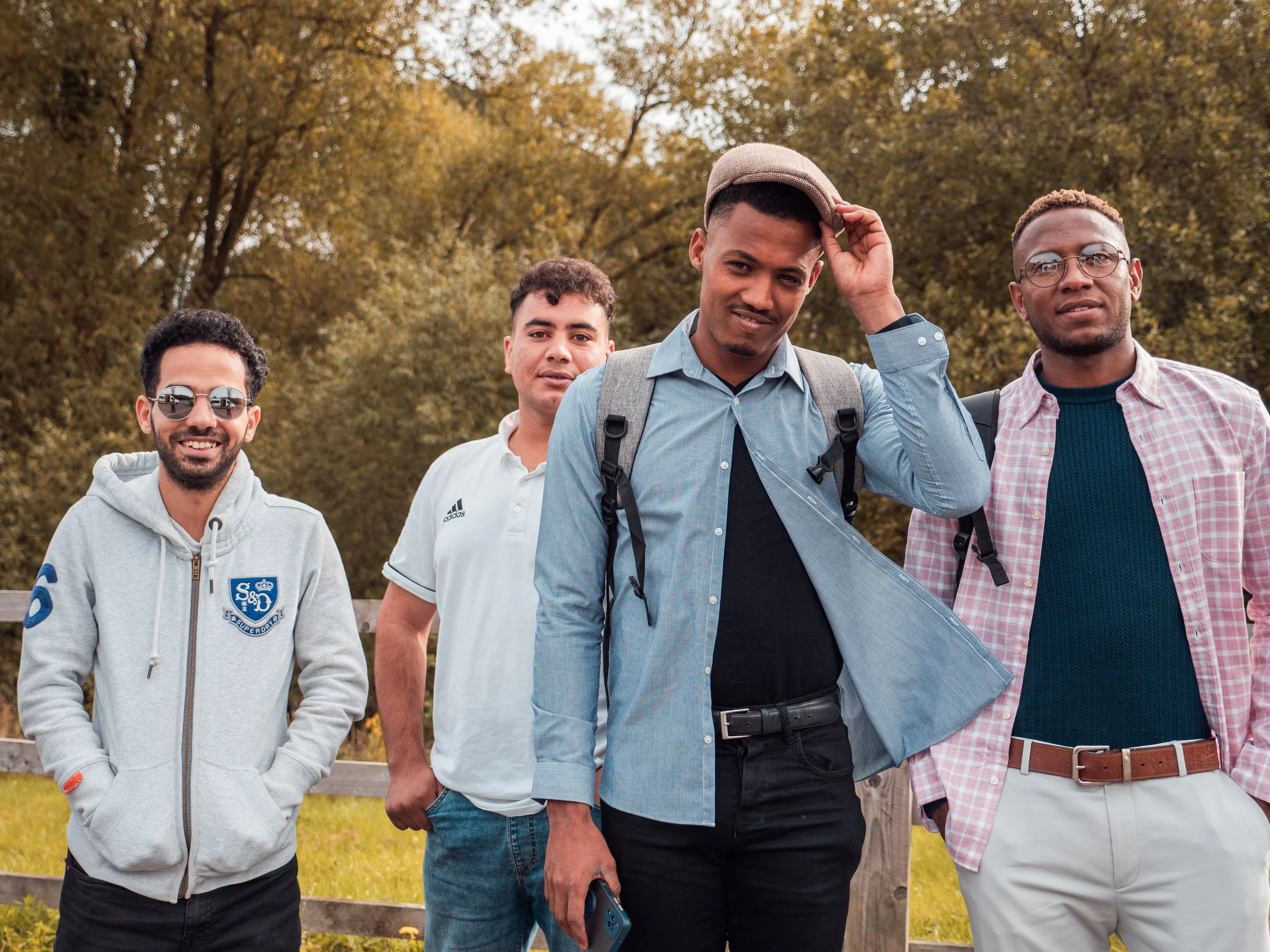 Group of young men walking in park