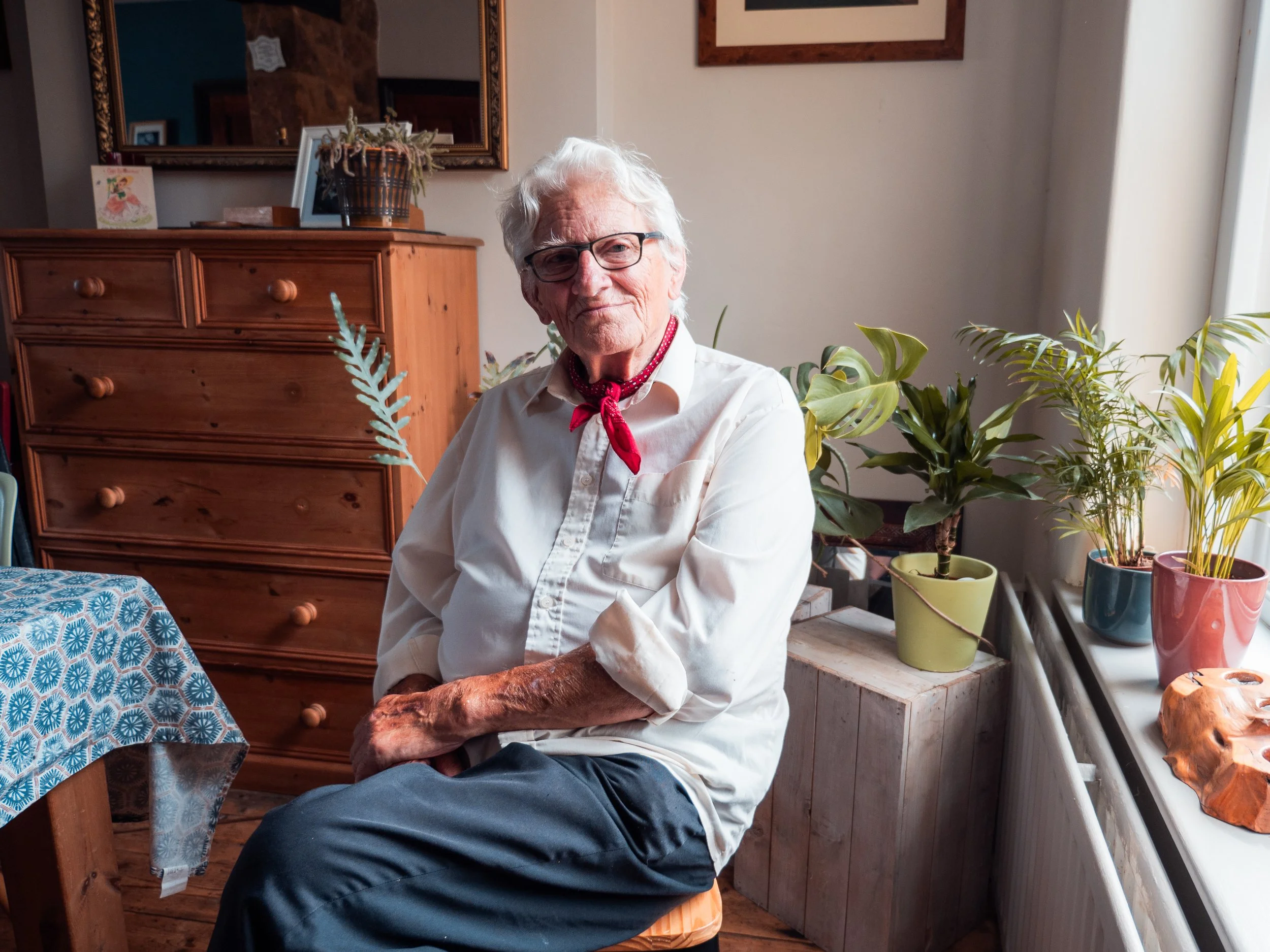 Man in white shirt and red cravat