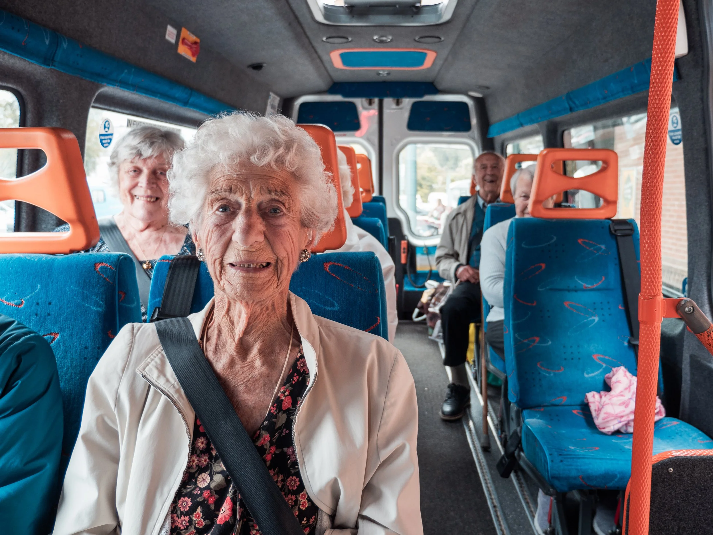 Group of older people on a bus
