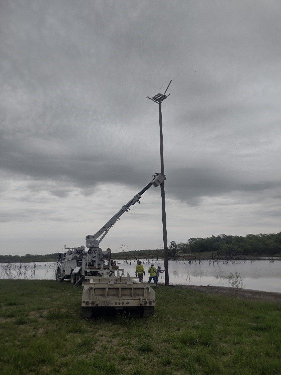  The local eclectic co-op installing Osprey nest platforms that I constructed for the local Audubon society.&nbsp; They are hoping to record the first osprey nest in Kansas. 
