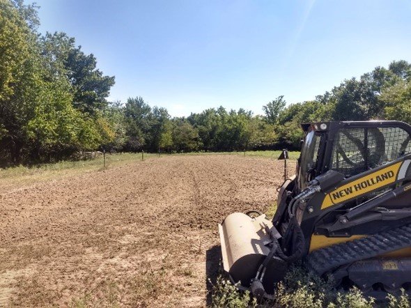 A compact track loader being used to till a food plot. 