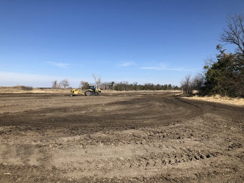 Pulling dirt from the higher elevations on either side of the old borrow pit increases the size of the wetland footprint