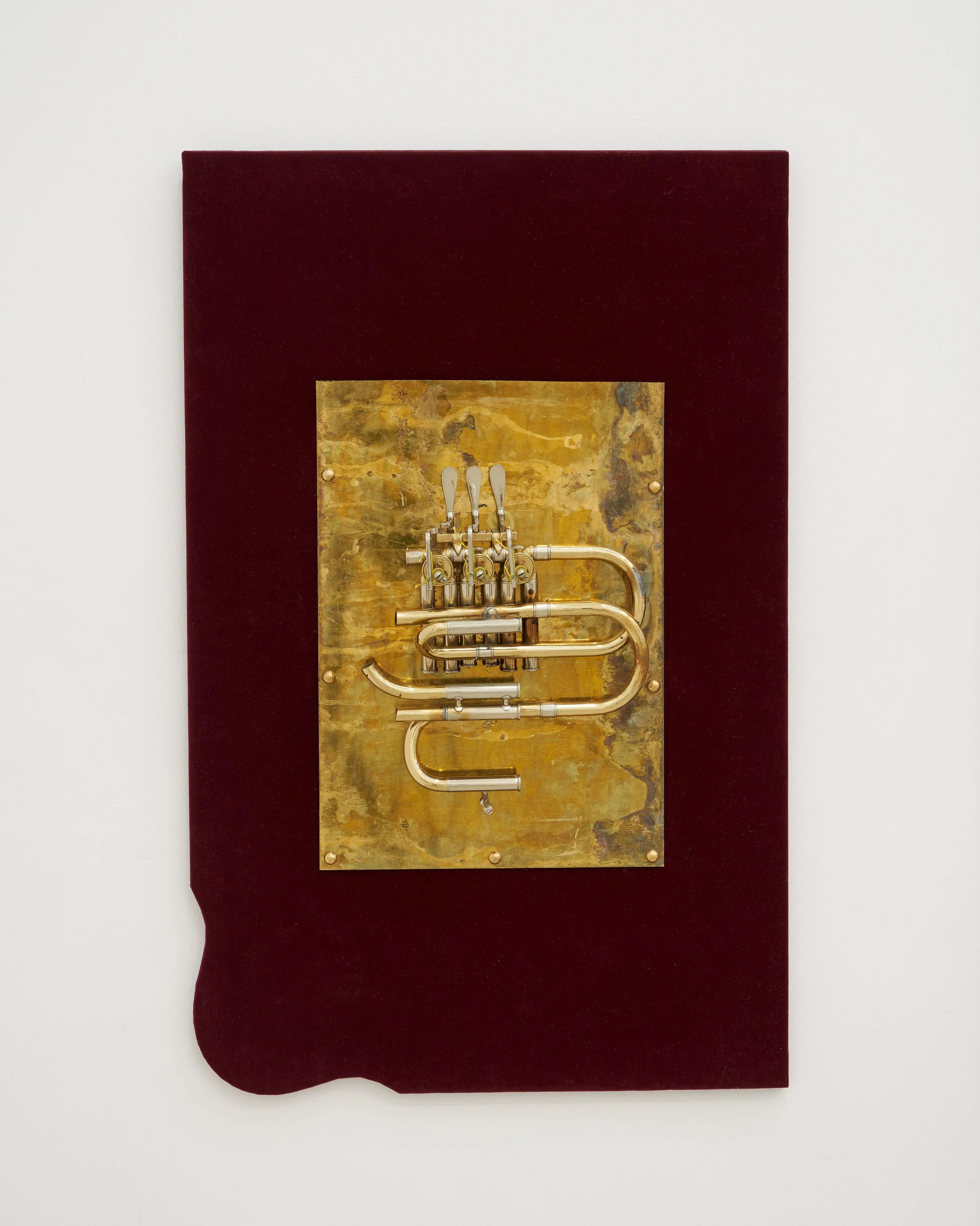 Gozié Ojini, Save Your Breath (Untitled), 2026. Altered brass instruments, velvet. 31 3/4 x 20 3/4 x 3 1/2 inches