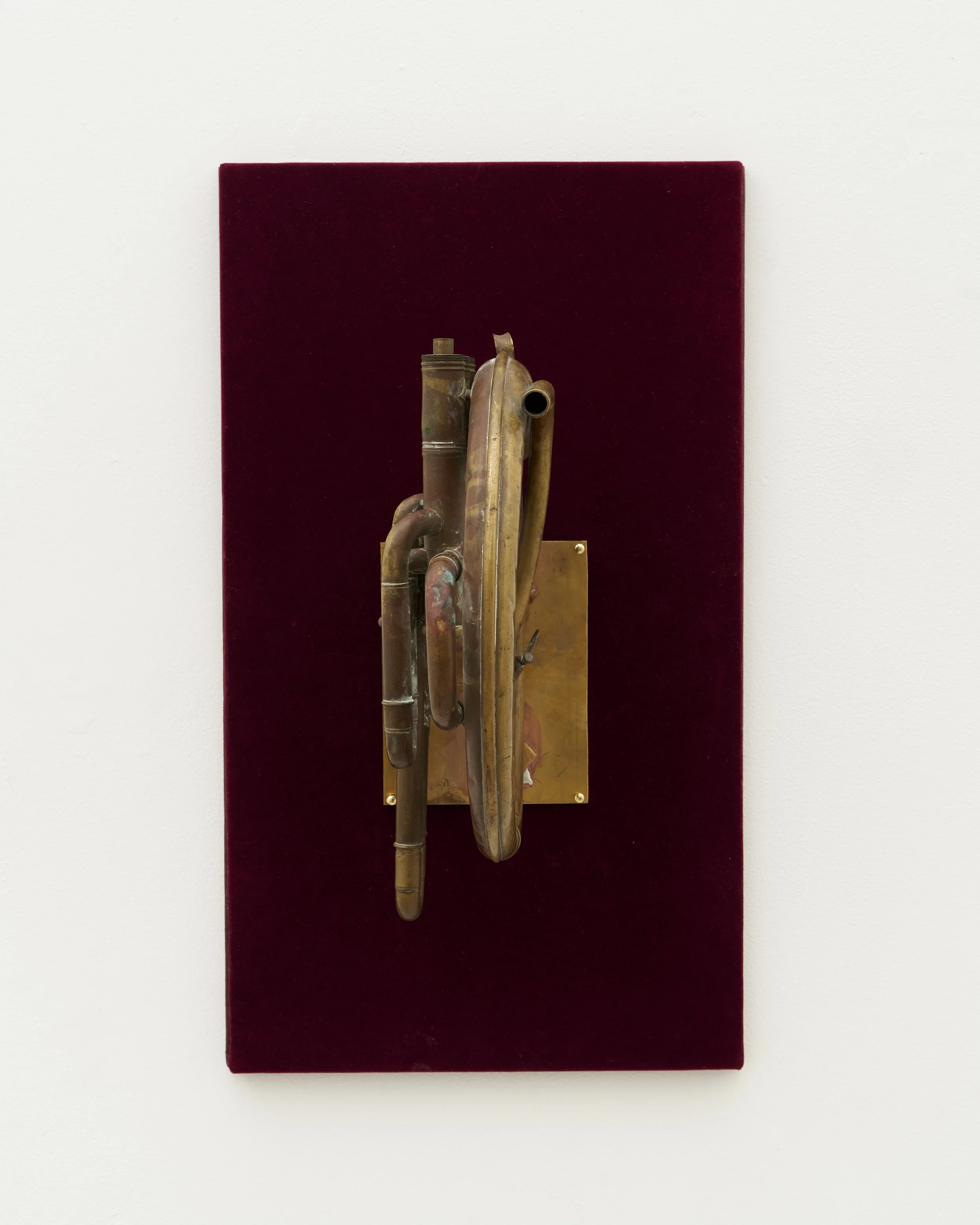 Gozié Ojini, Untitled, 2025, Altered brass instrument, velvet, 18 x 12 x 10.5 inches | 46 x 30 x 27 cm