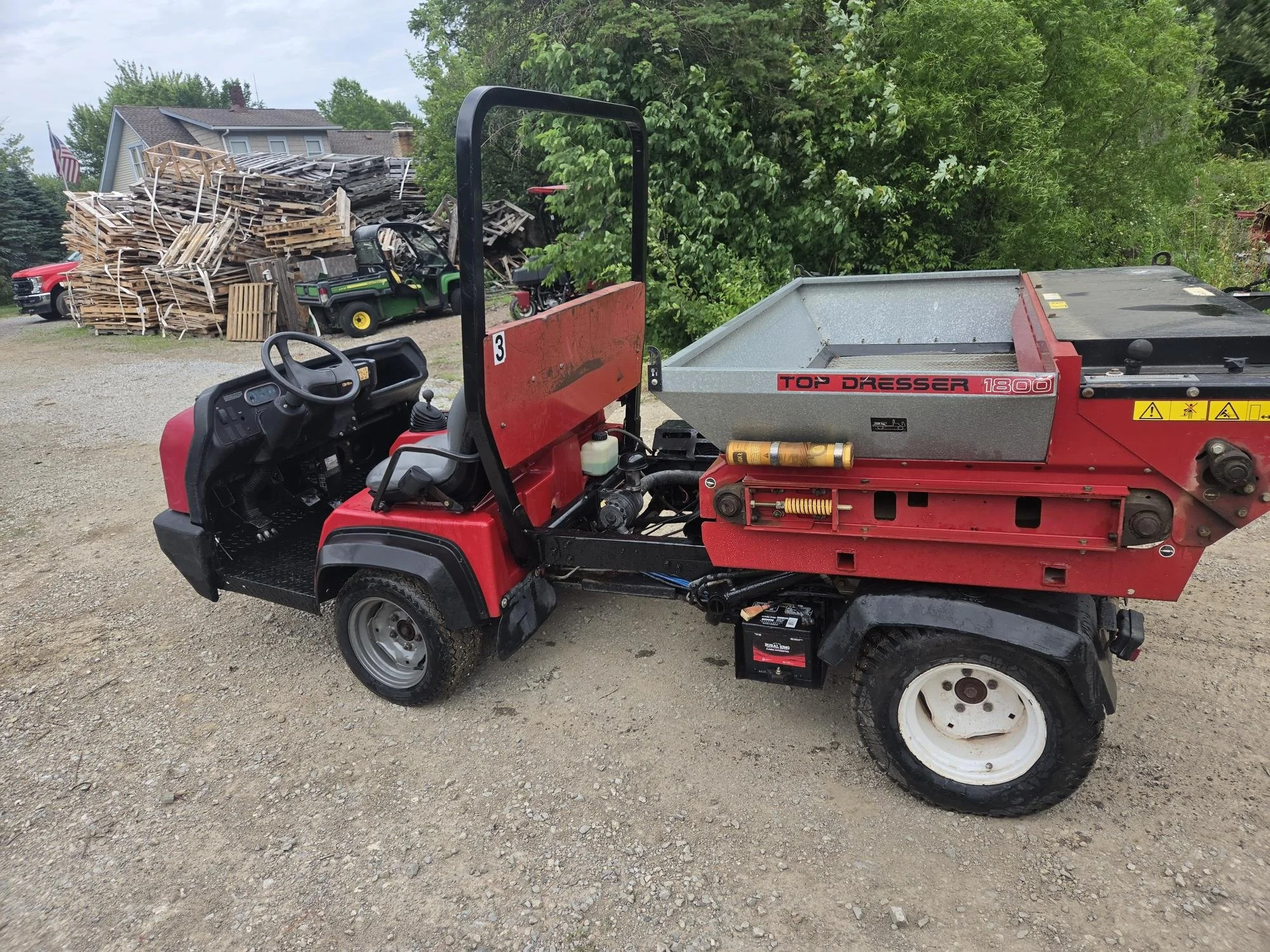 2013 Toro HDX gas watercooled unit with Toro topdresser and a bed
