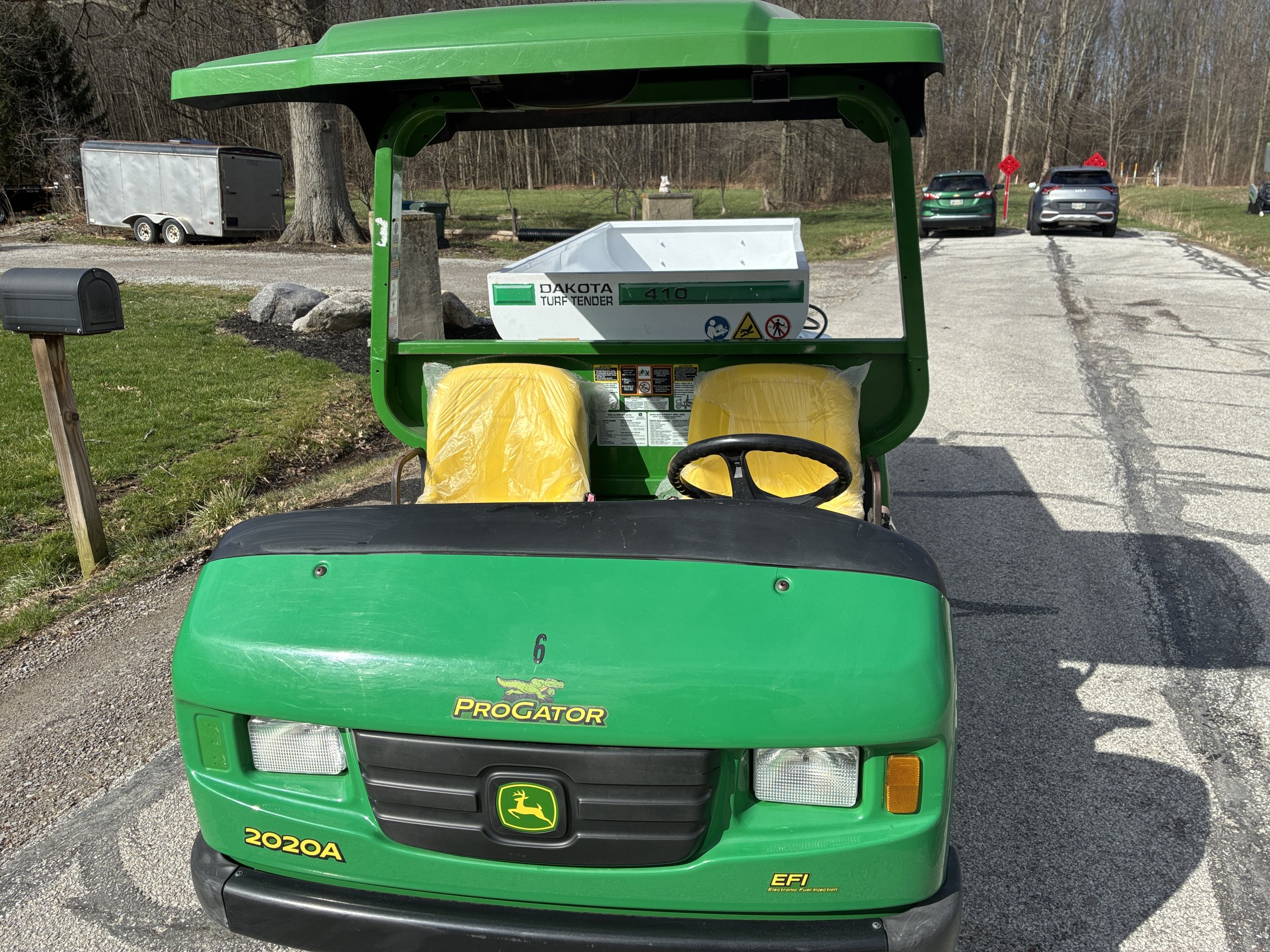 2020 John Deere 2020A progator with a 2007 Dakota spinner topdresser