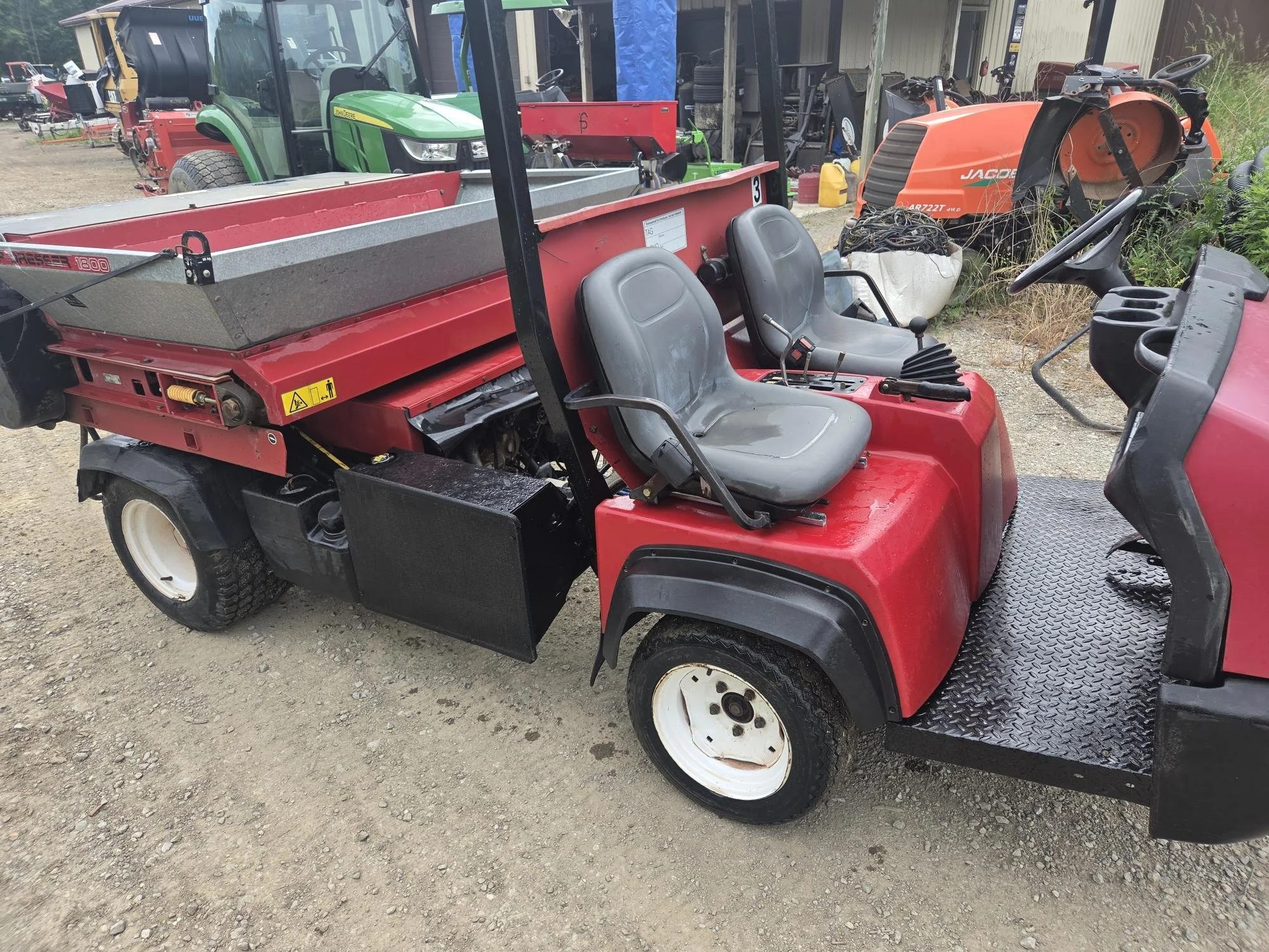 2013 Toro HDX gas watercooled unit with Toro topdresser and a bed