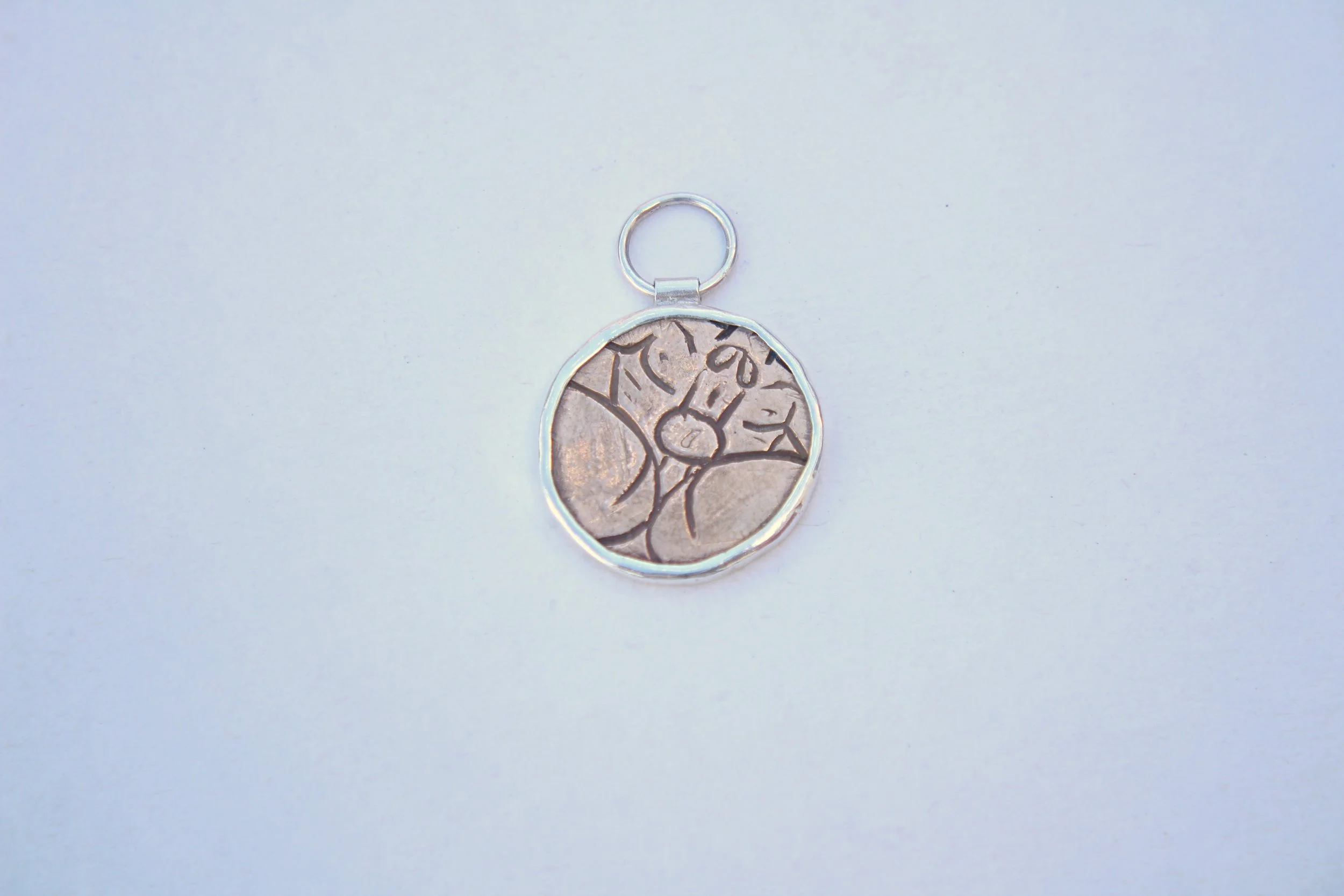 TrevorMock_Tainted_PendantFront - Trevor Mock.JPG