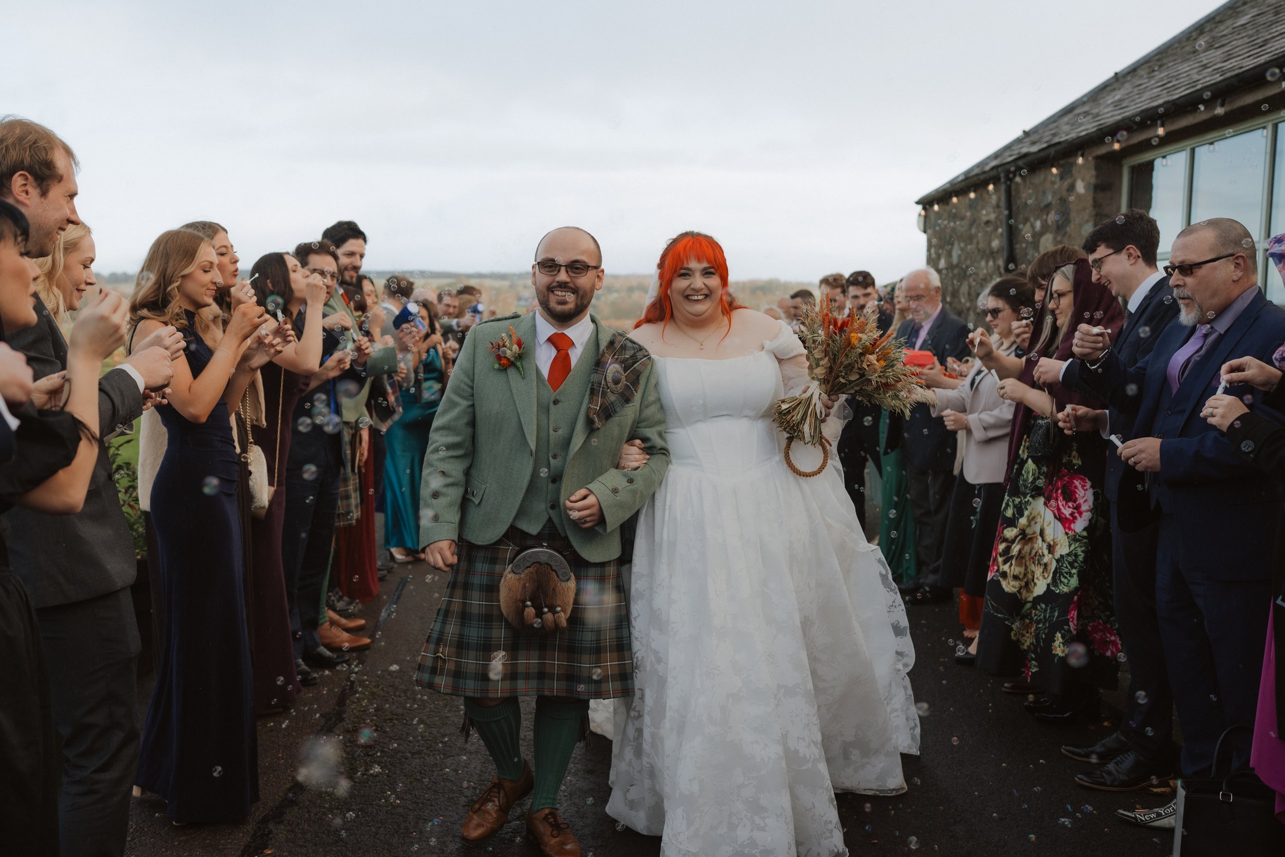 Should I consider booking a second photographer for my wedding?