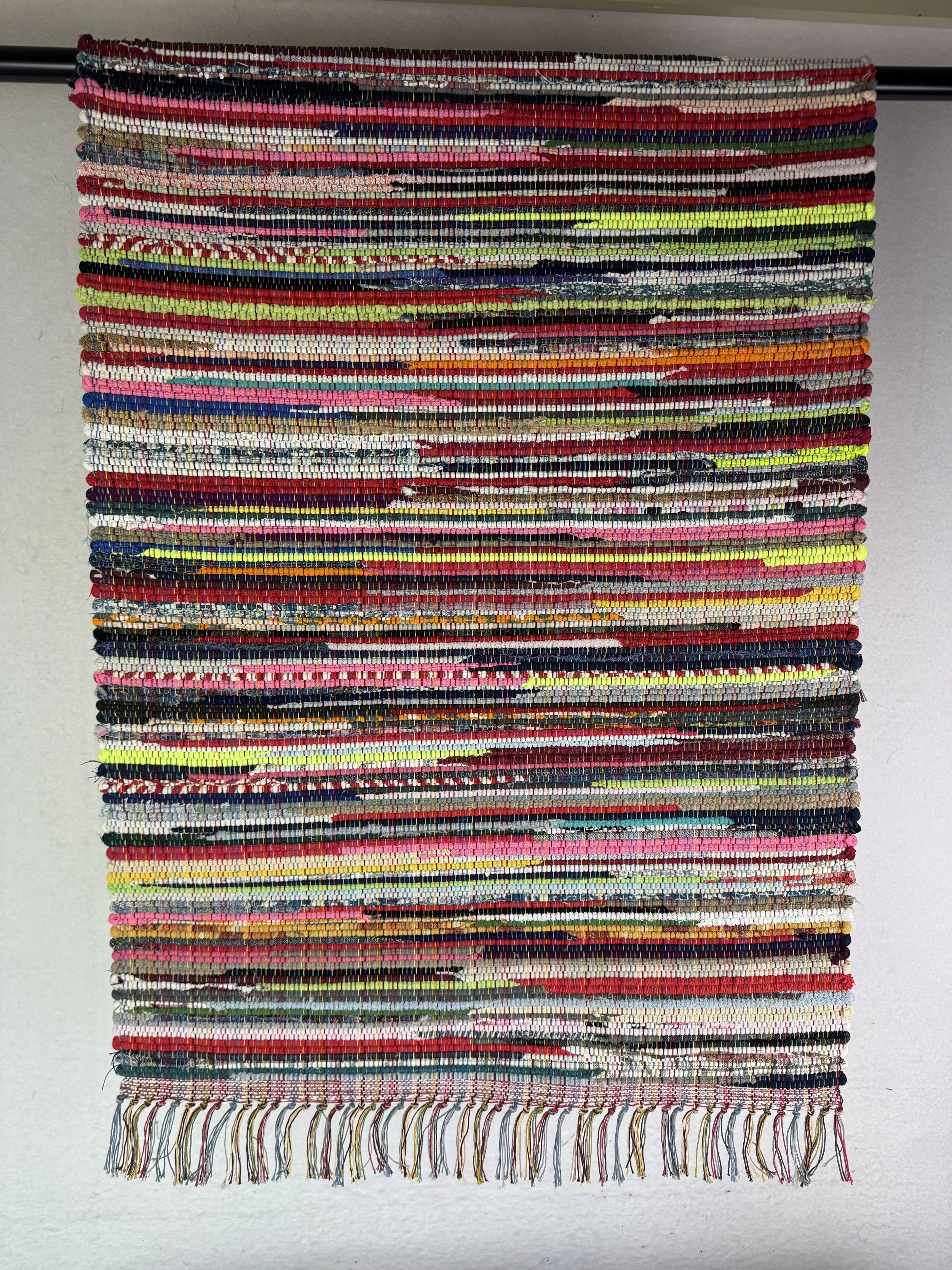 Hanging rag rug showing pattern and texture