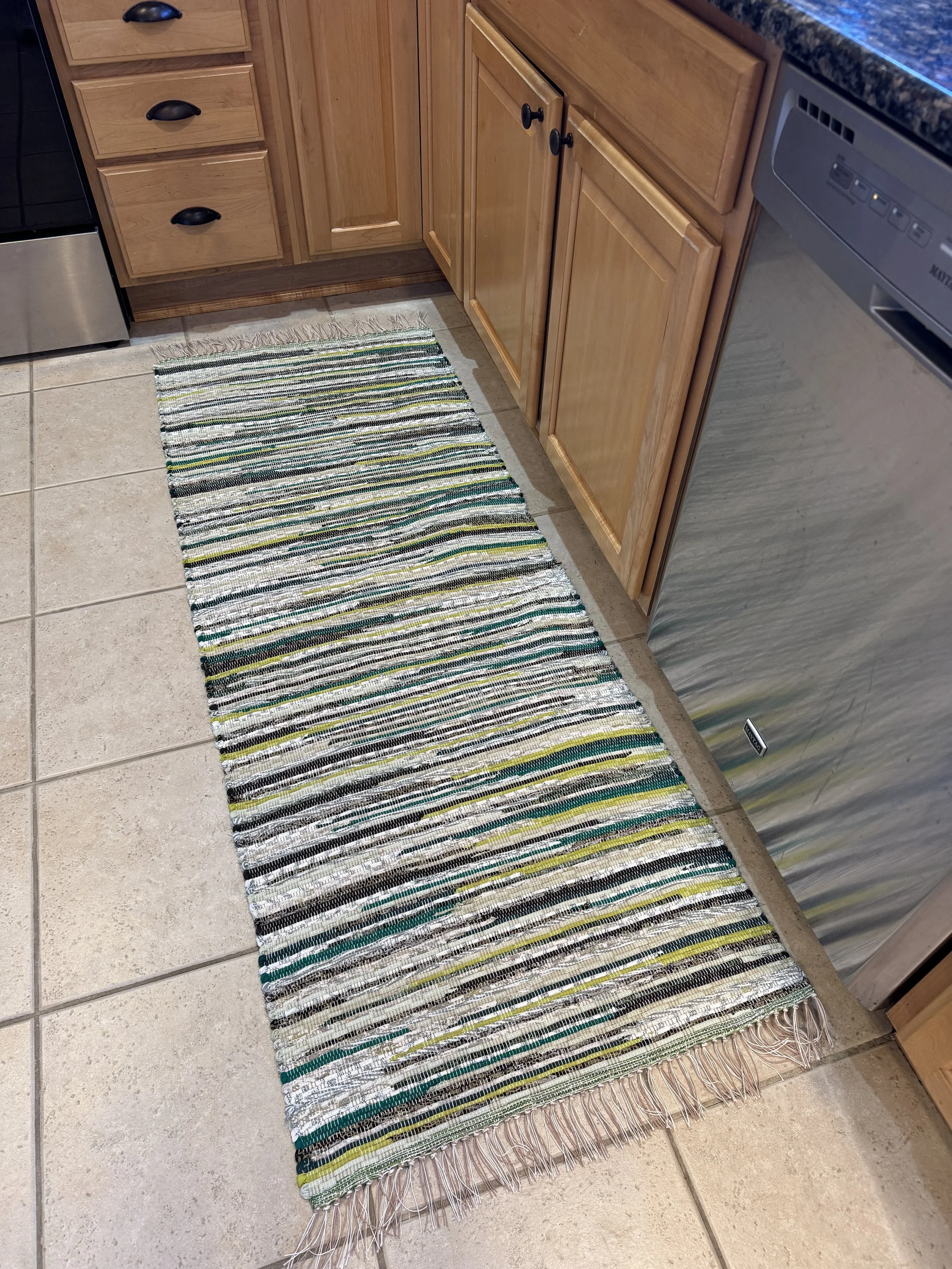 Handmade upcycled cotton rug displayed in kitchen
