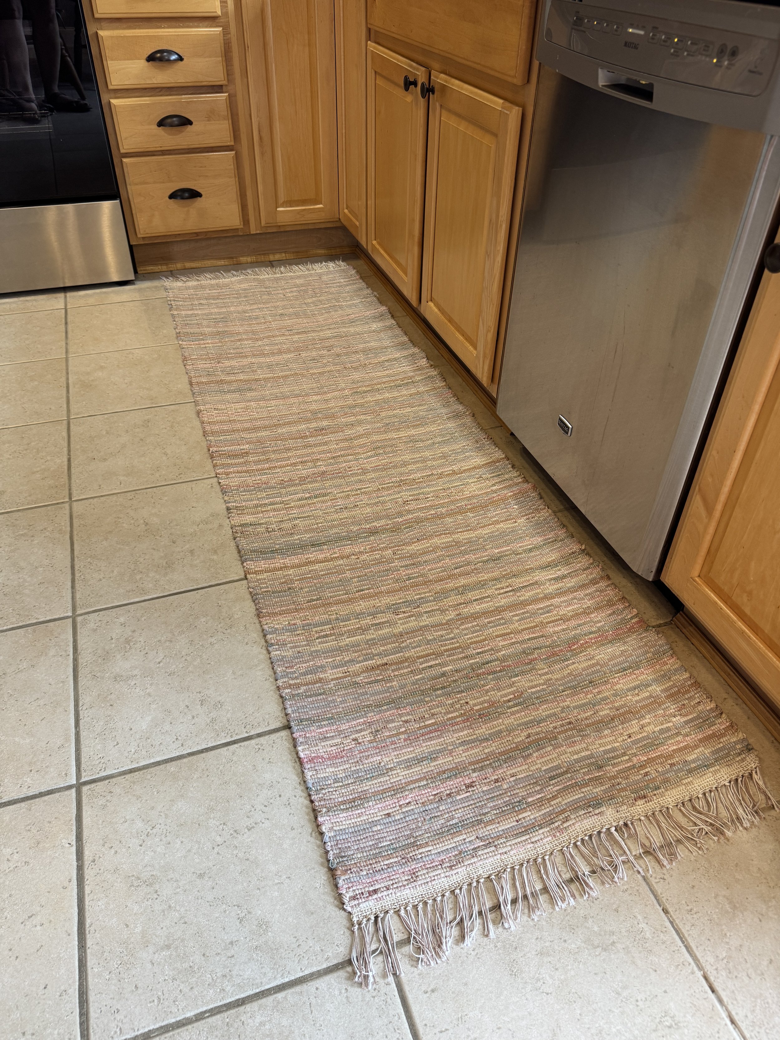 Handwoven rag rug displayed in kitchen showing pattern