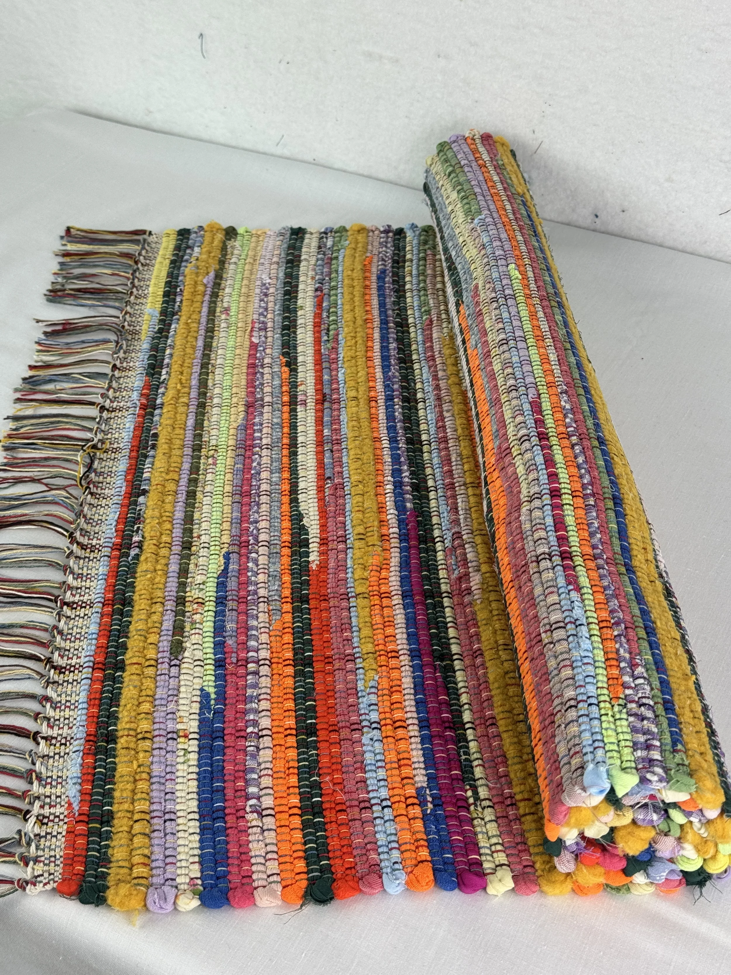 Bright colored handwoven rag rug