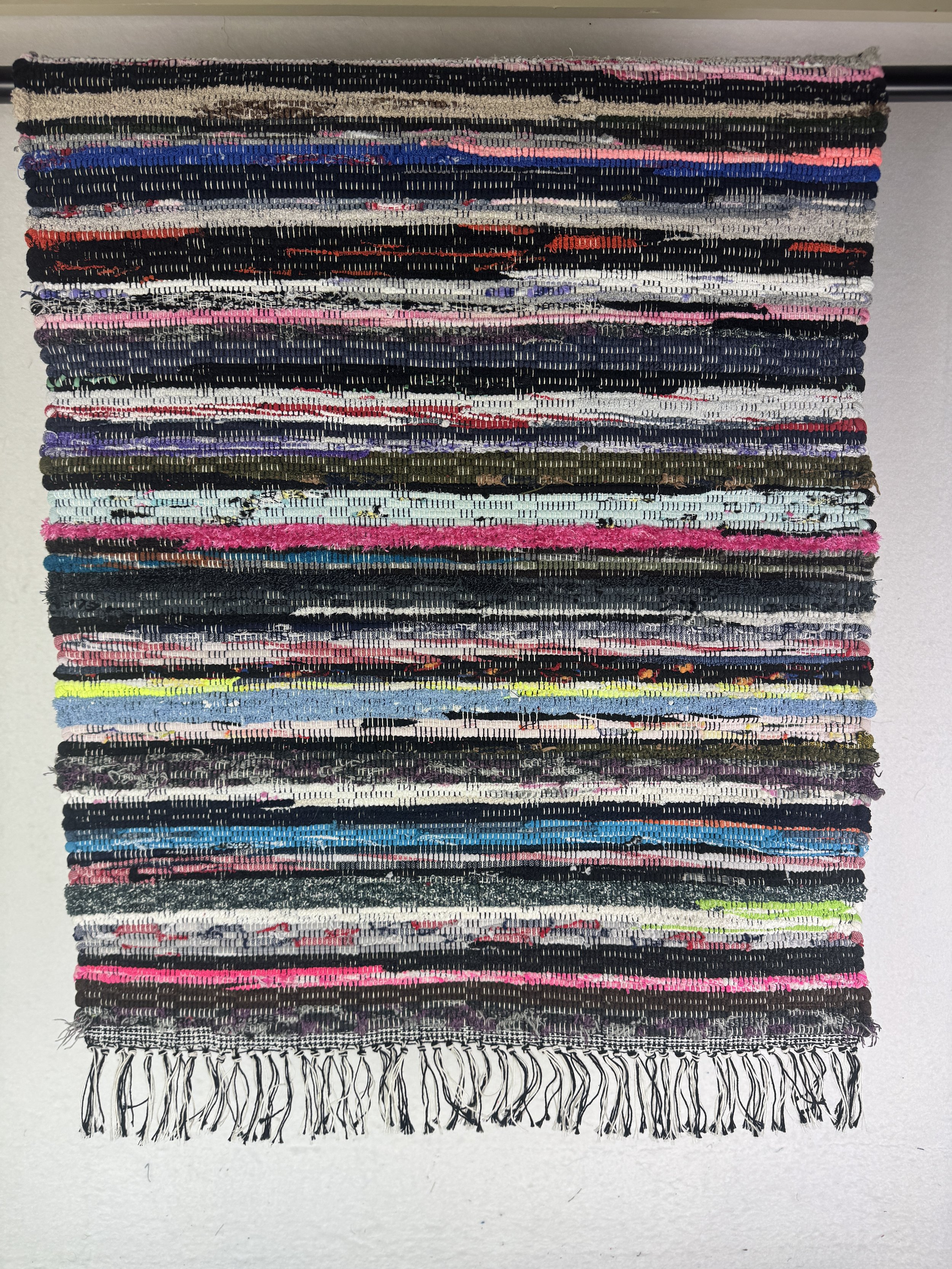 Hanging rag rug showing texture