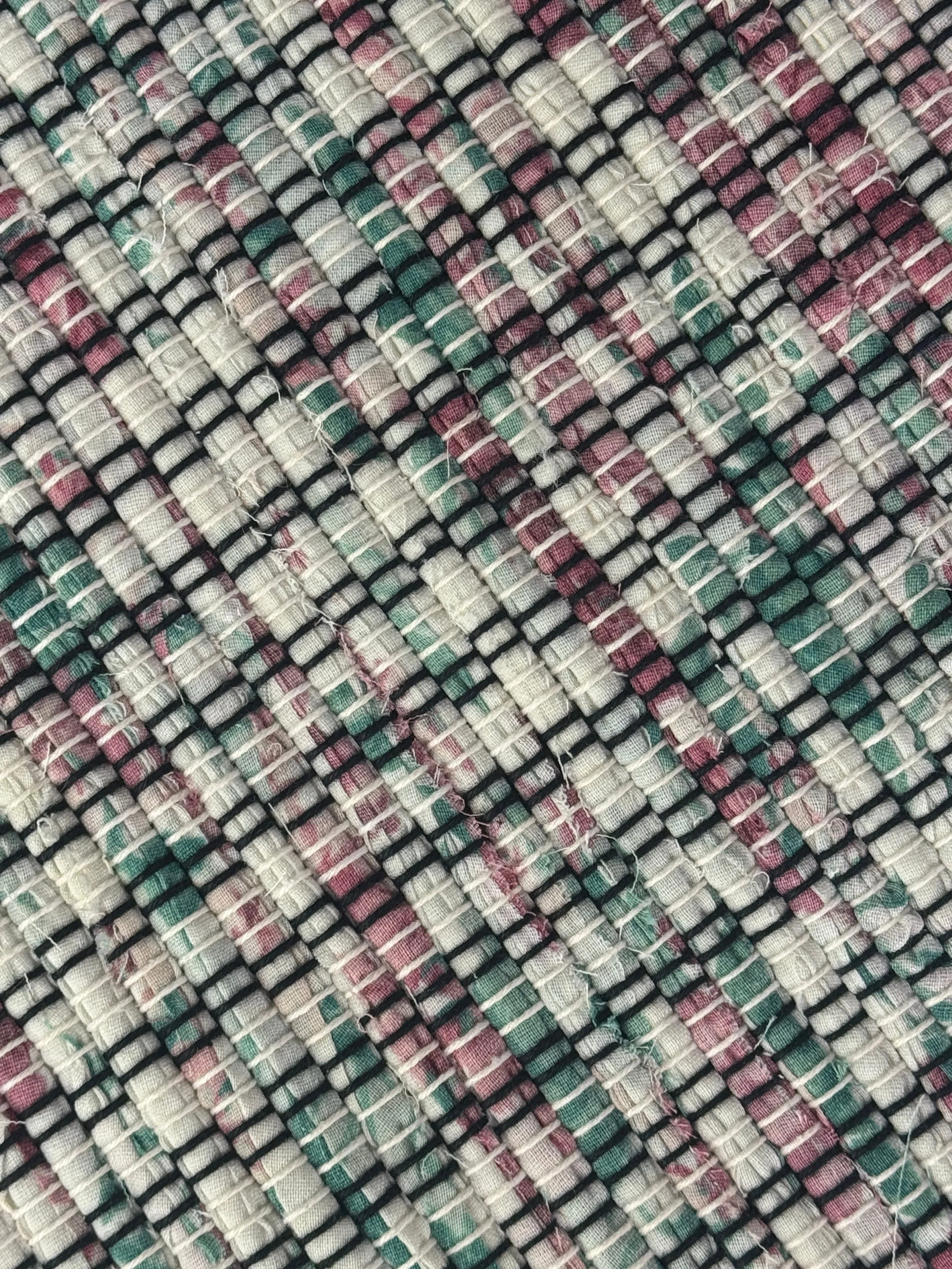 Pastel handwoven rag rug close up texture and pattern