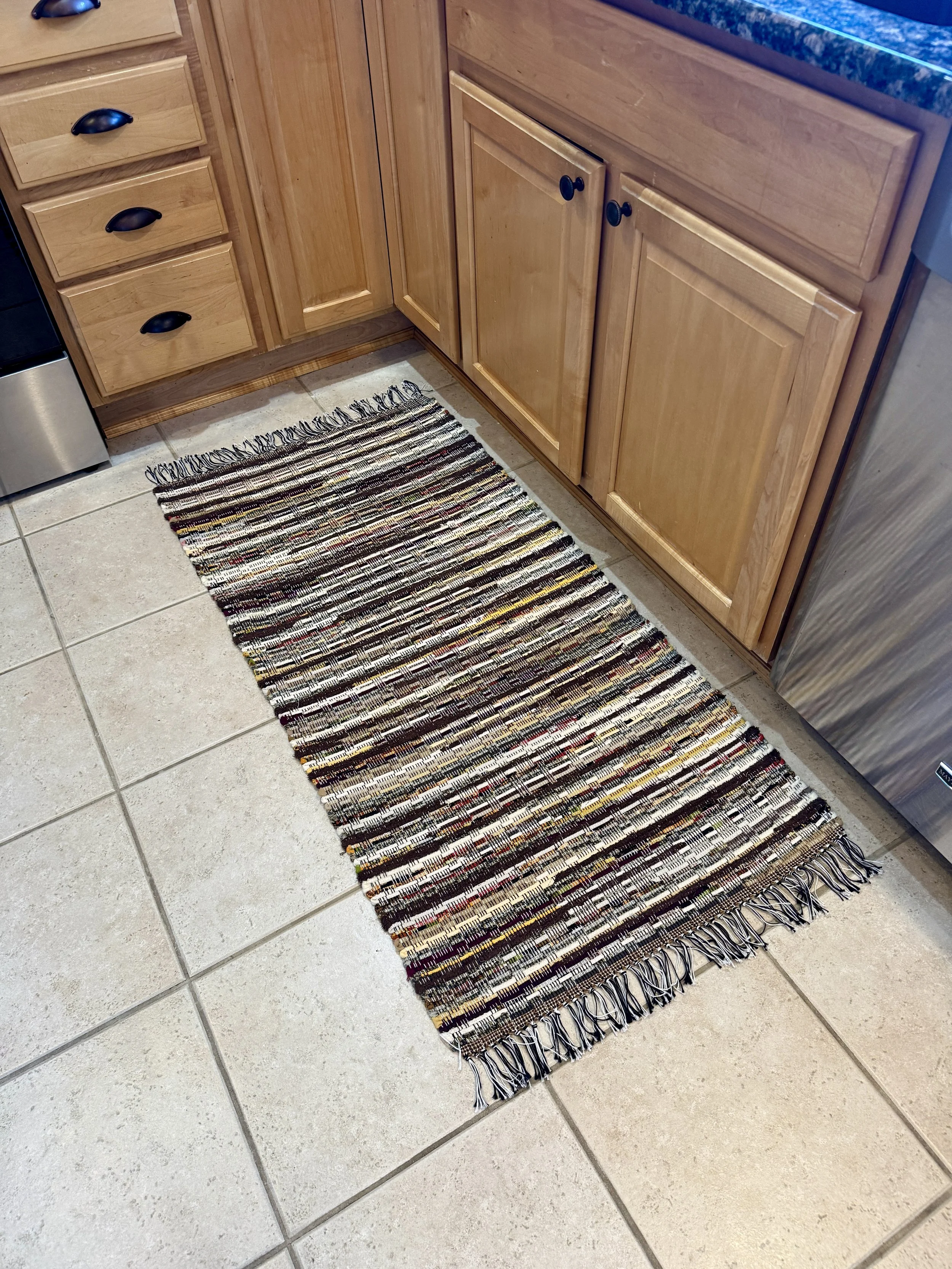 Handmade rag rug displayed in kitchen showing full pattern