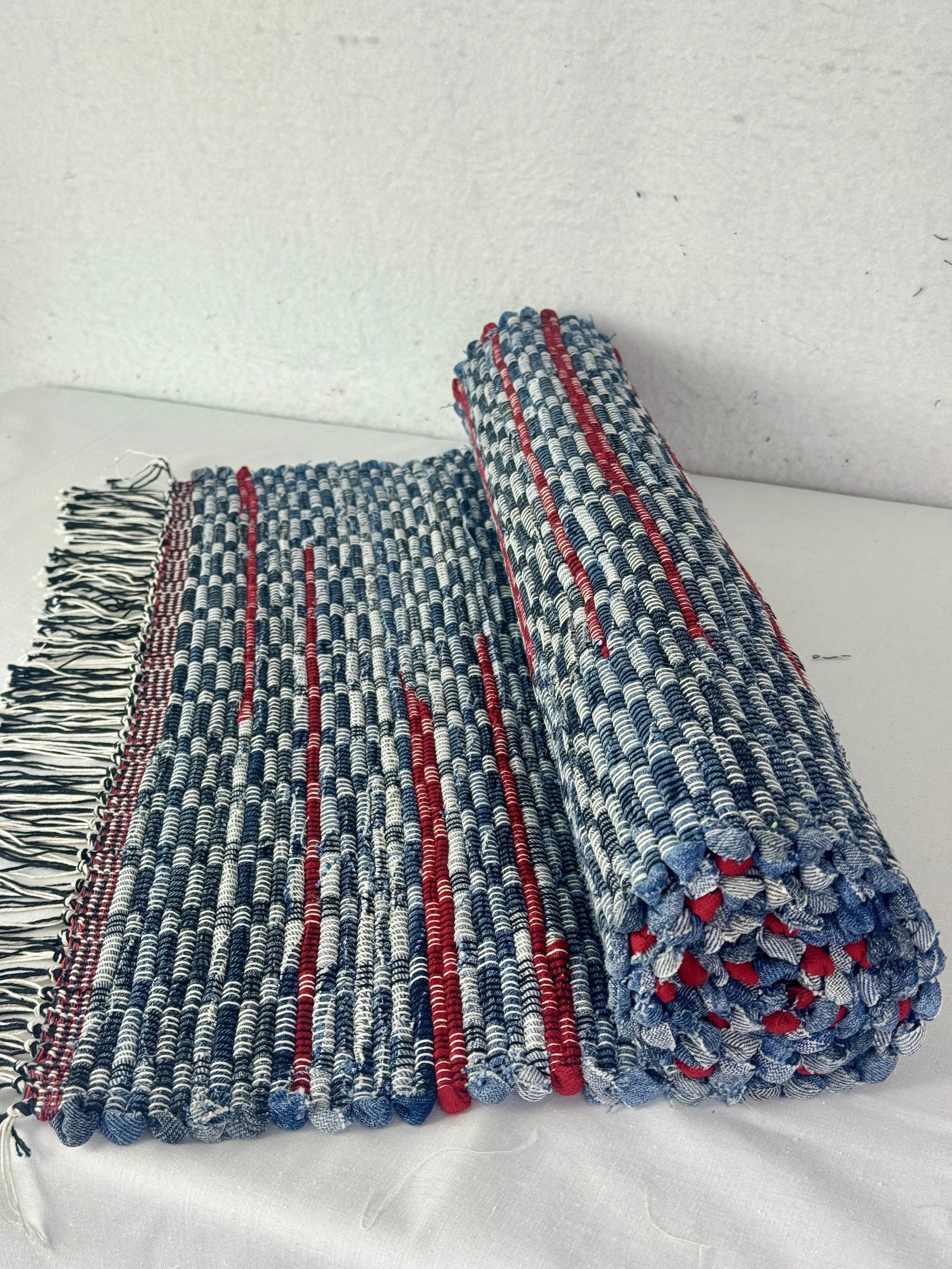 Handwoven denim w/red accents rag rug made with upcycled blue jeans and cotton scraps