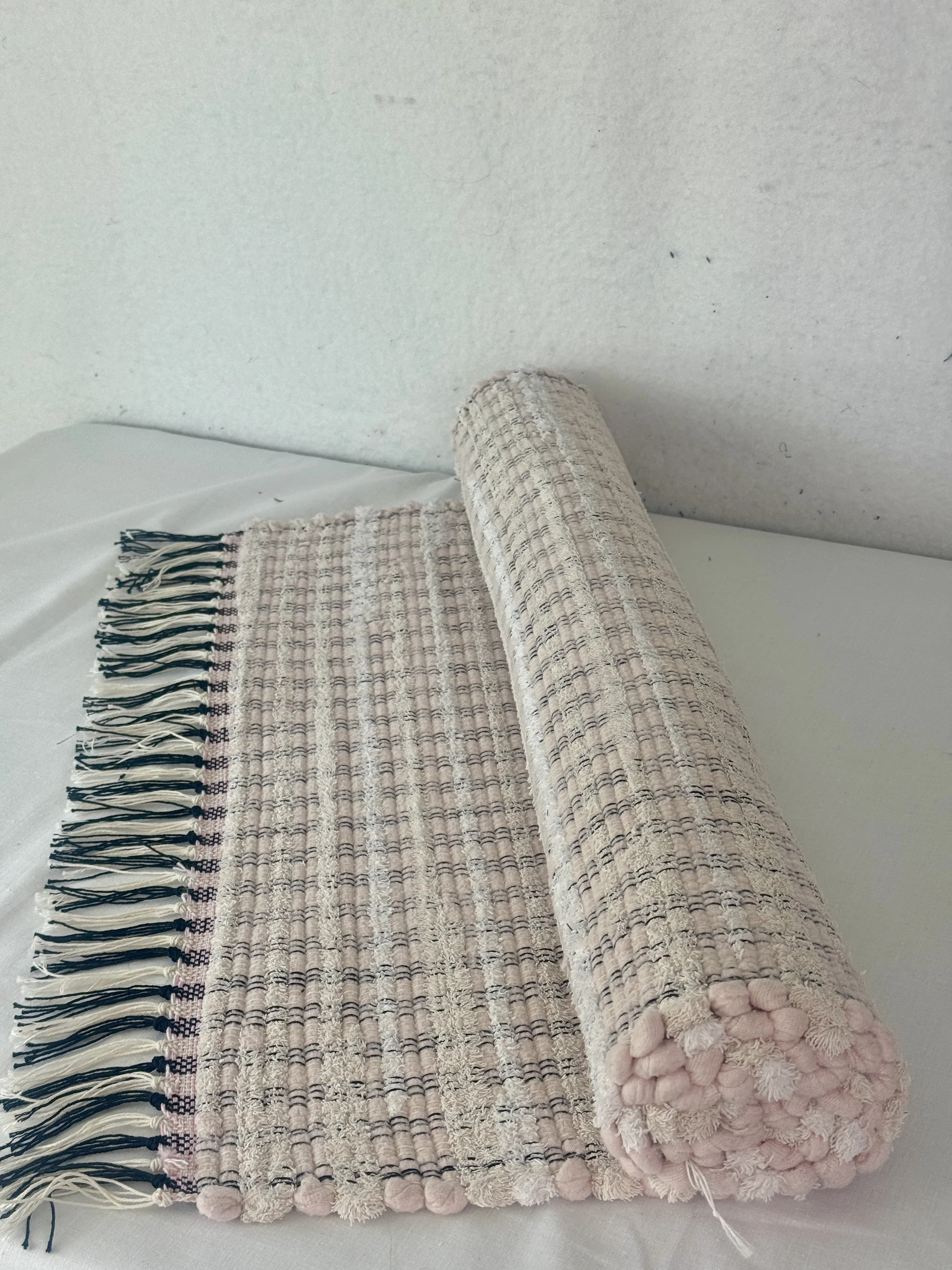 Handwoven pink and white rag rug 25 x 51 made with recycled textiles