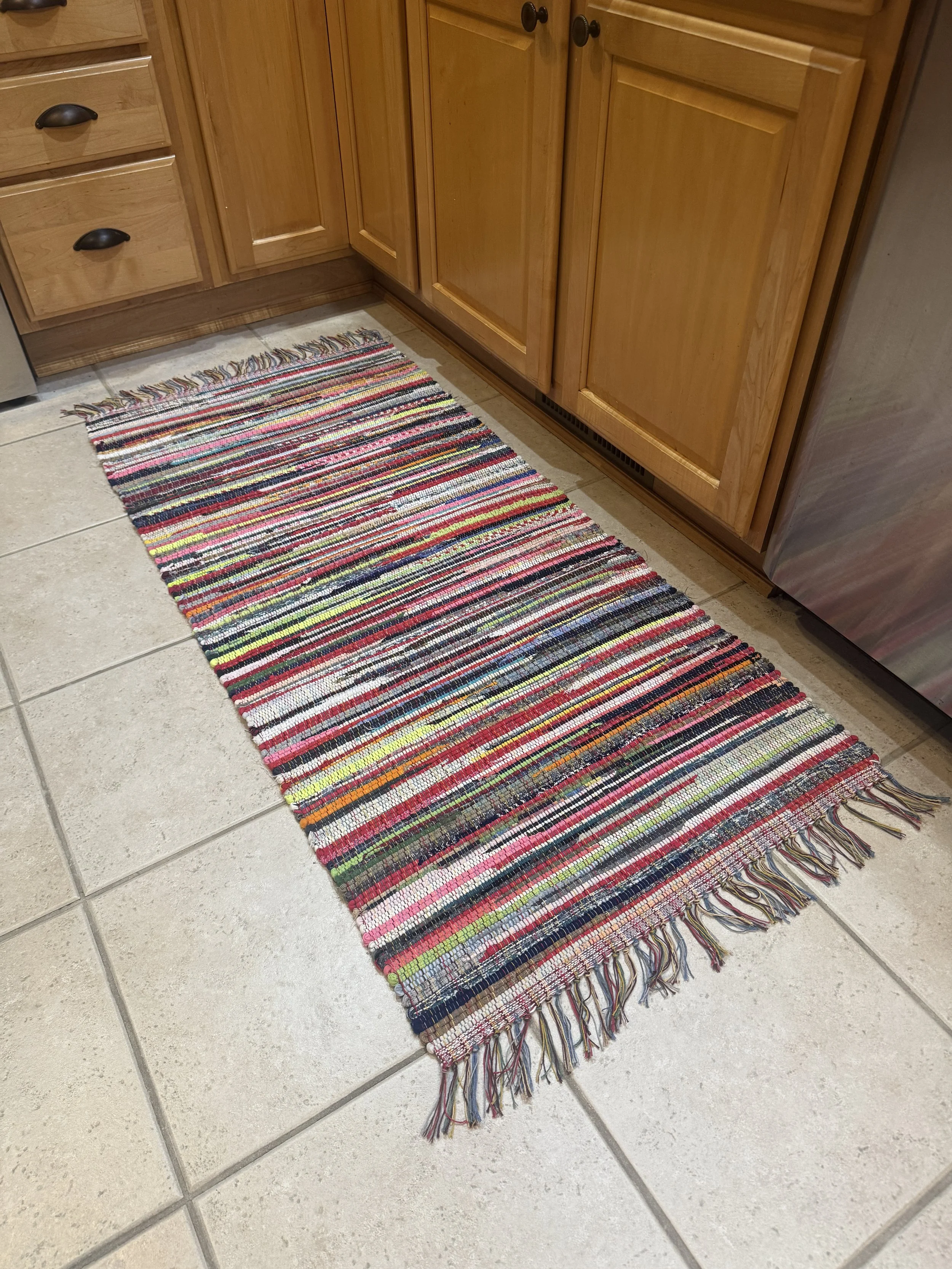 Handwoven rag rug displayed in kitchen