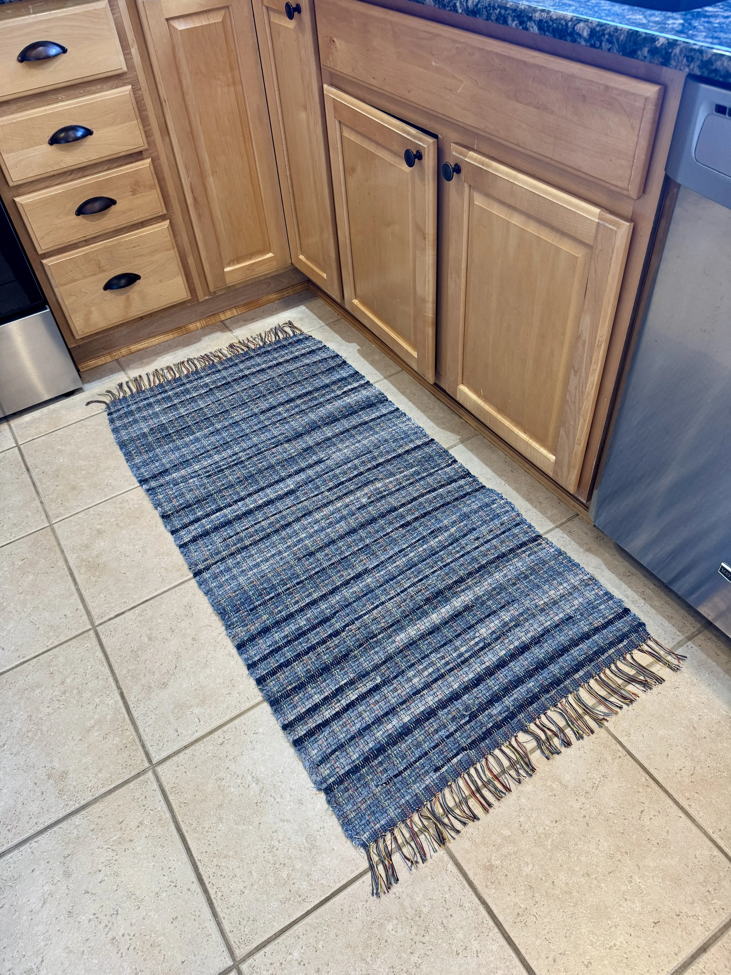 Handmade rag rug displayed in kitchen showing full pattern