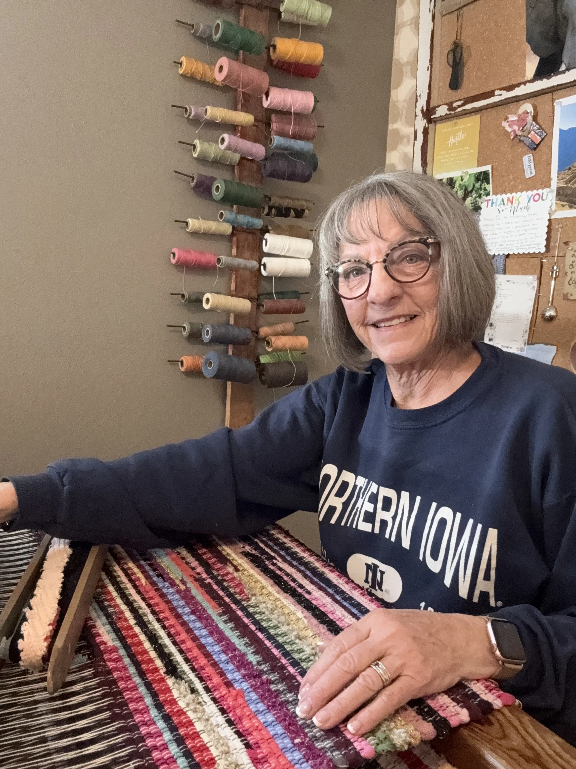 Terry weaving a handwoven rag rug on a wooden 2 harness floor loom