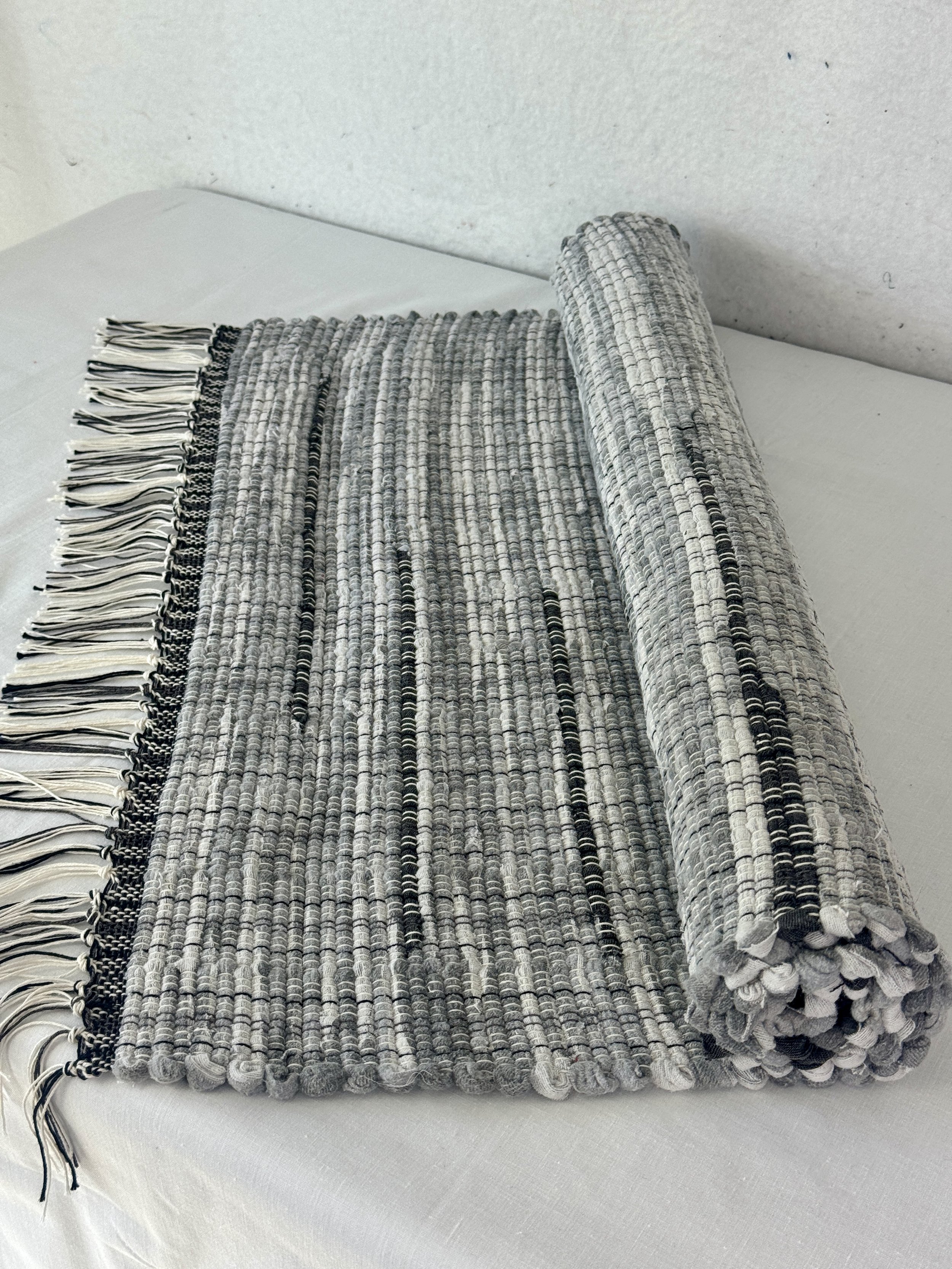 Handwoven gray 25 x 38 woven rag rug using recycled textiles