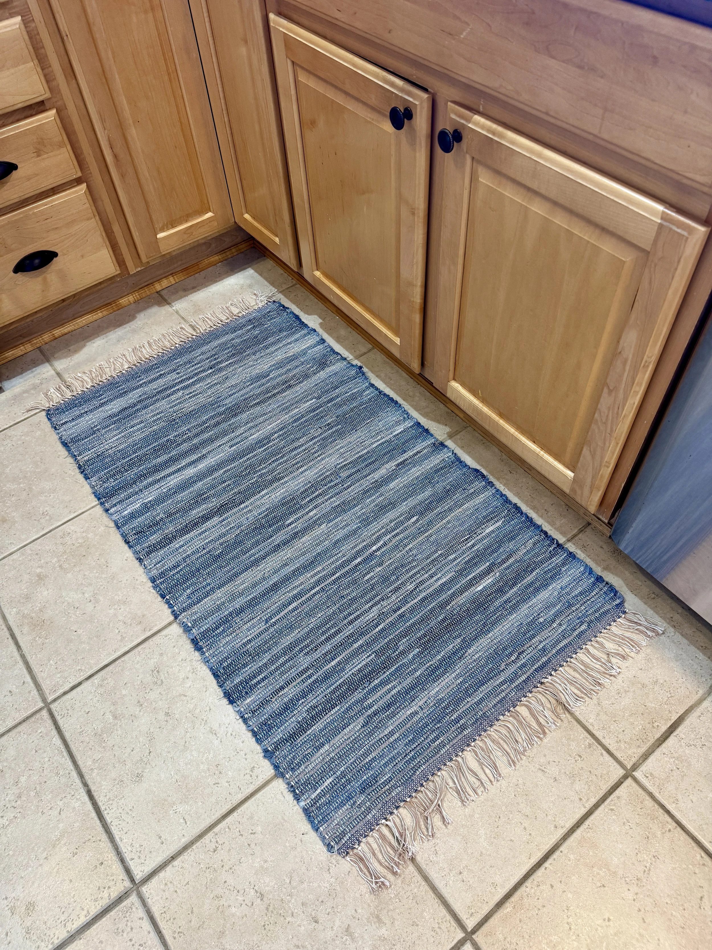 Displayed denim handcrafted rag rug in kitchen