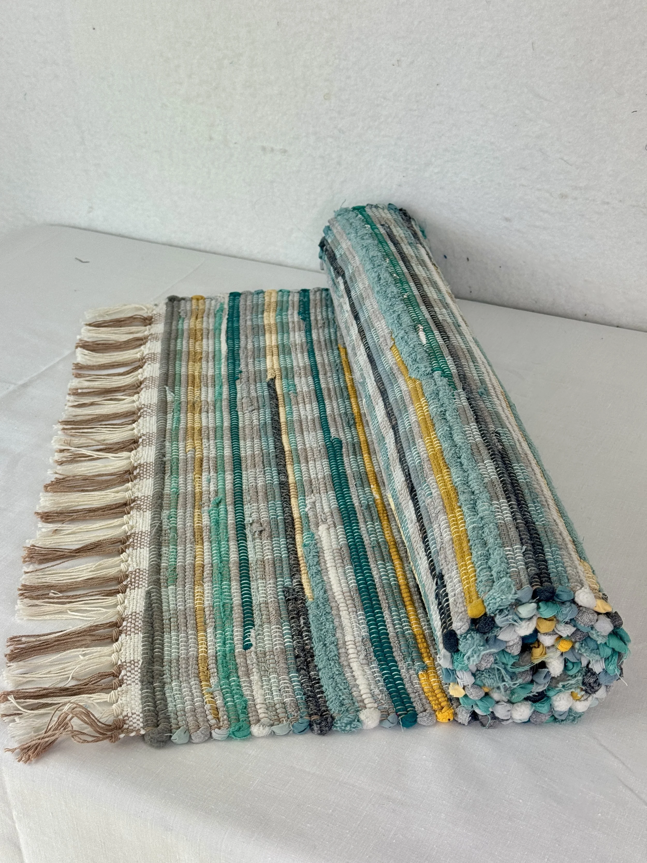 Handwoven turquoise rag rug made from recycled cotton and cotton blends 25 x 58