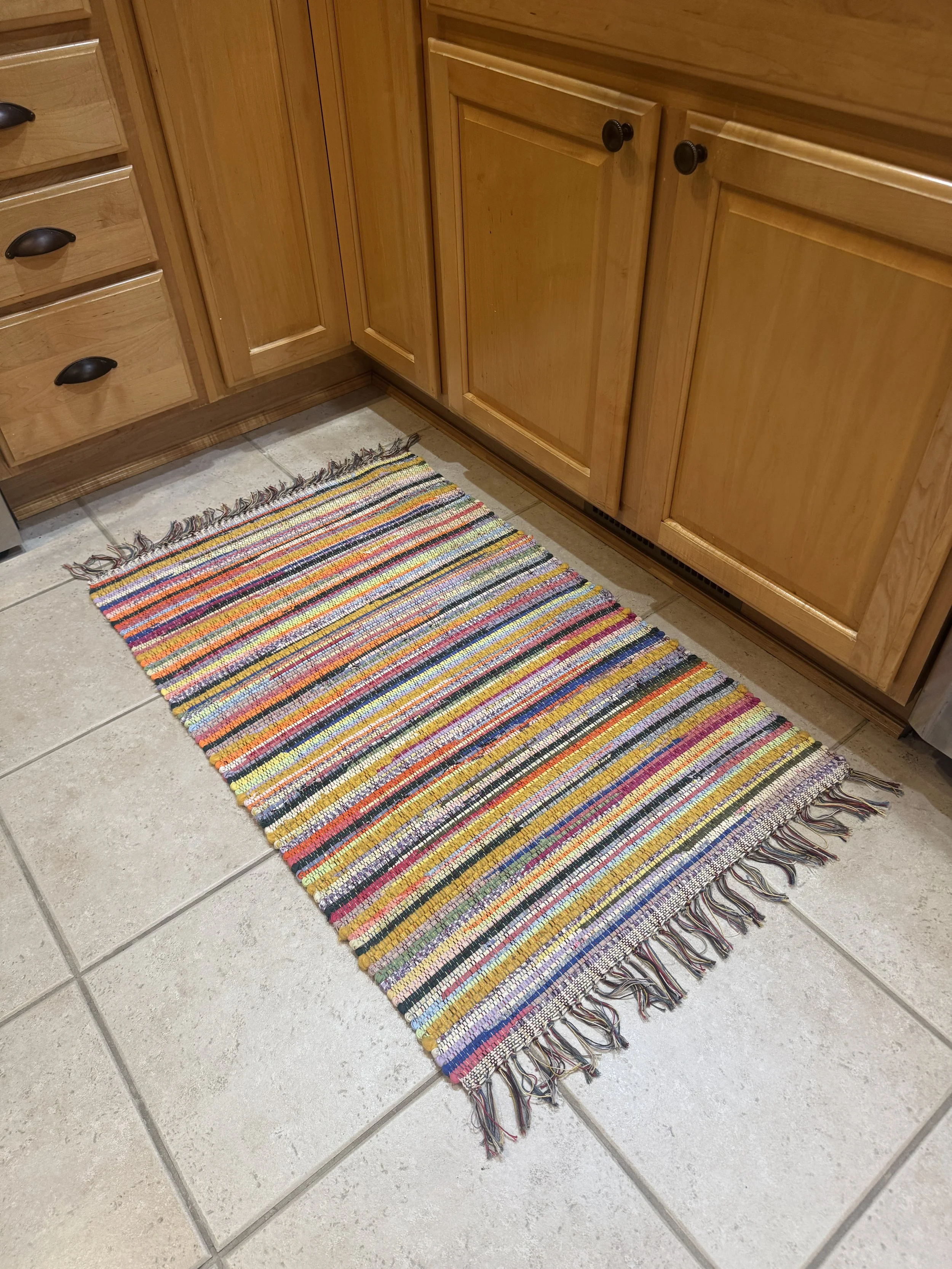 Handwoven rag rug displayed in kitchen