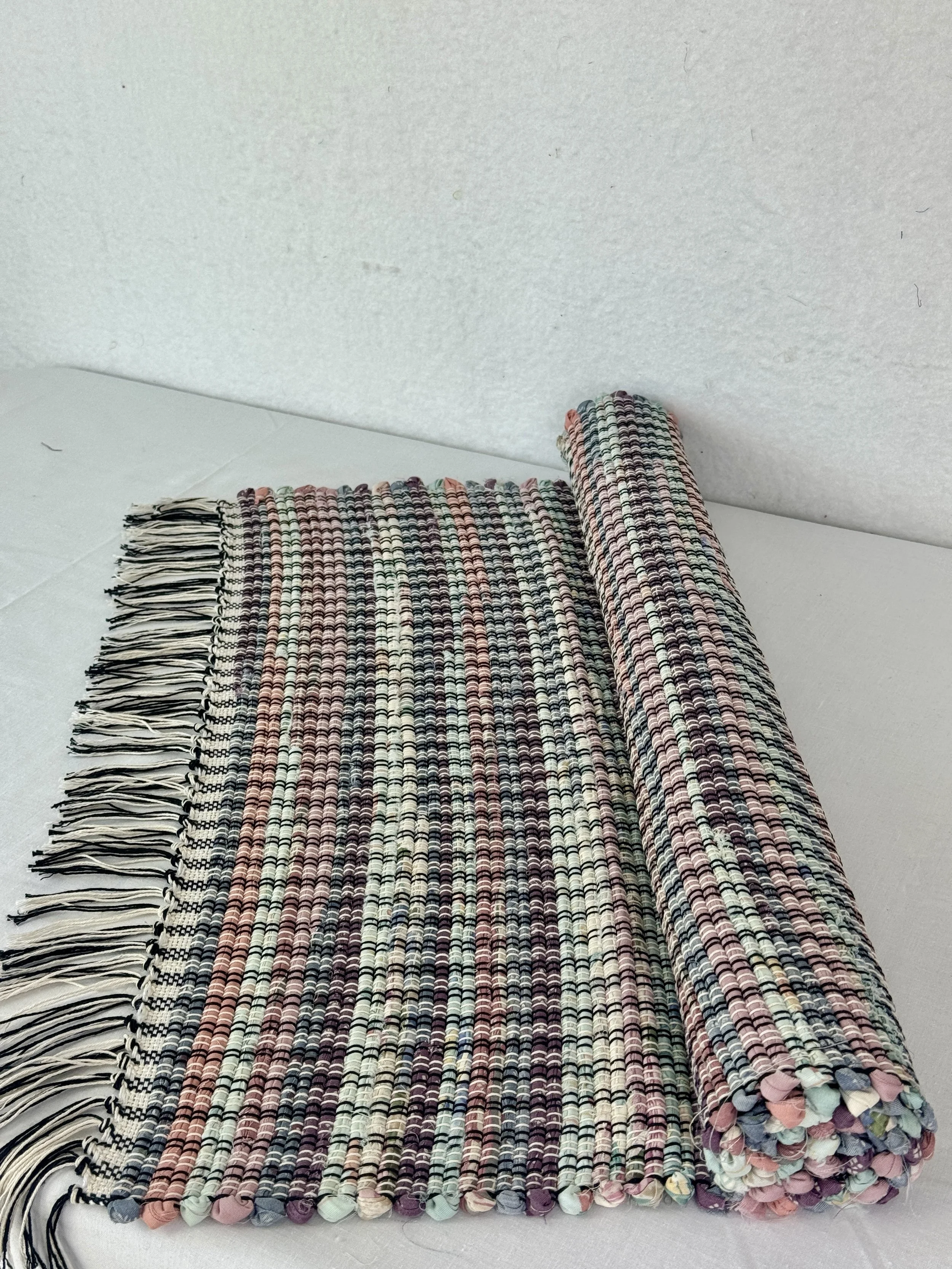 Handwoven pastel rag rug made from recycled cotton fabrics 25 x 40