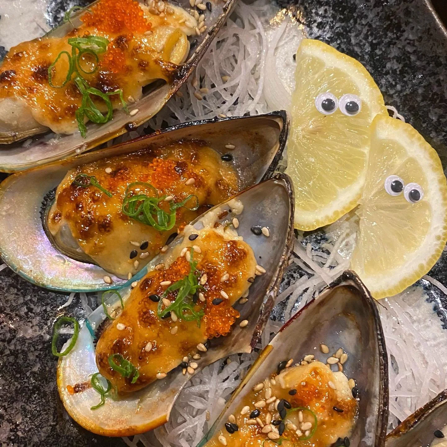 Baked mussels, J Spicy roll, Alaska Roll, and Sea Bass from @kazukiizakaya 👀🍣🥢

Not pictured: the bottles of Hana, Sho Chiku Bai Nigori, and Hakkaisan Hyotan we were throwin back 🍶