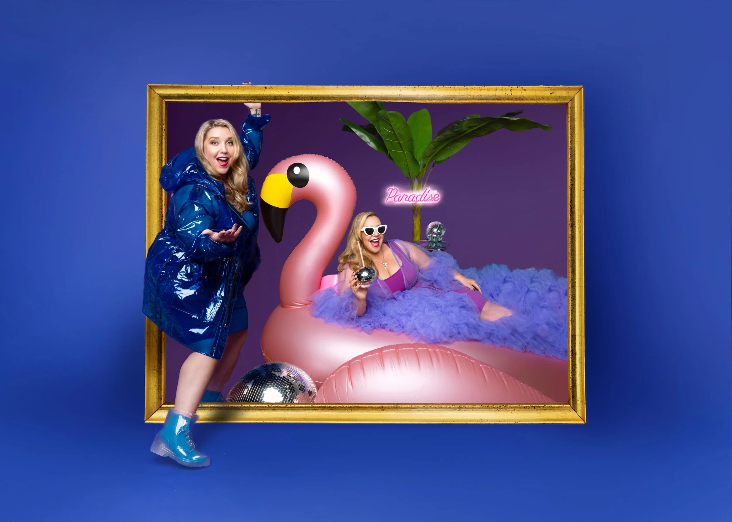 same woman on two sides of a threshold, one in glossy blue raincoat and the other floating on a giant flamingo pool float with a sign that says "paradise"