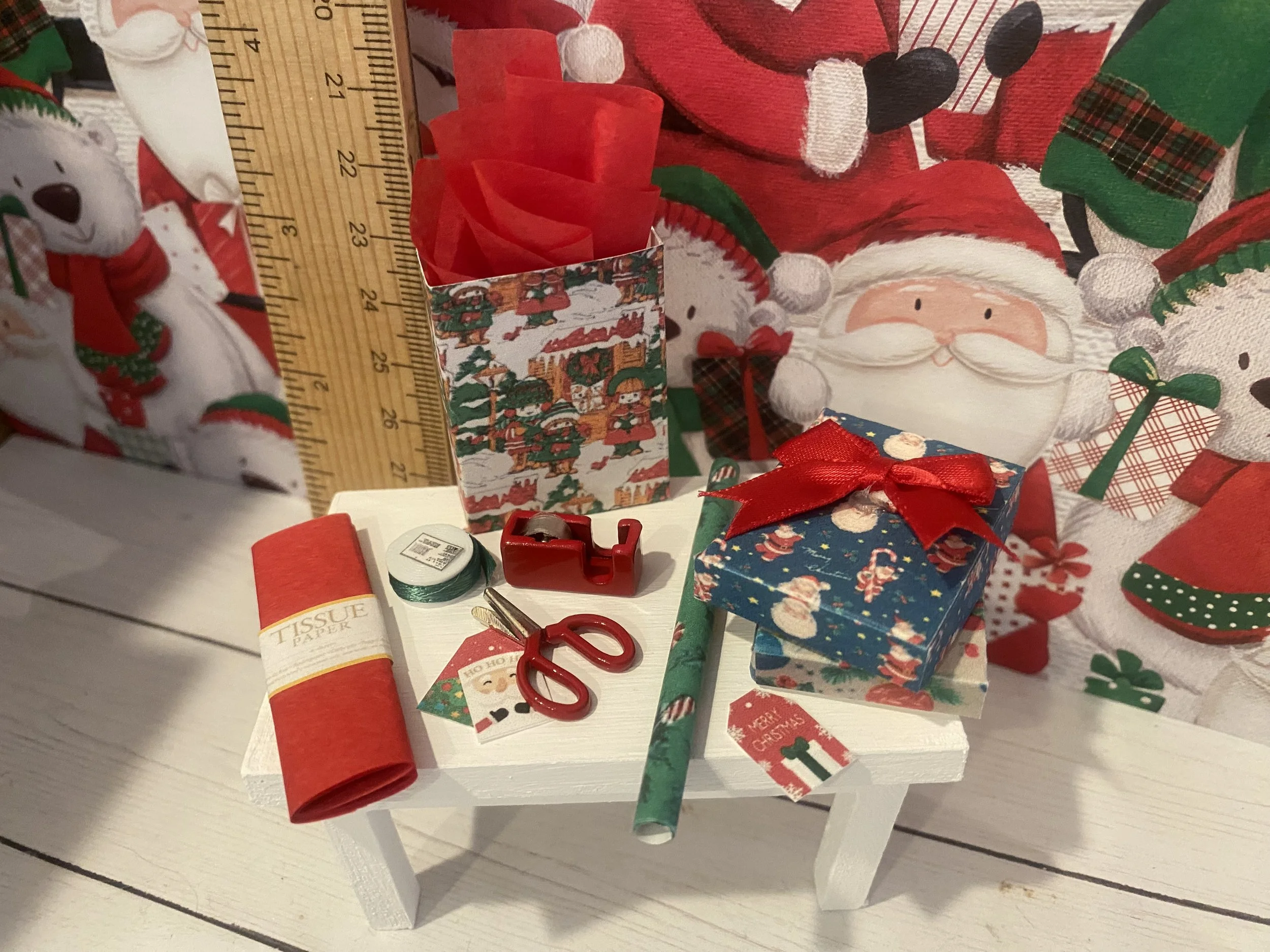 Miniature Gift Wrap Table with Red Tissue, Green Roll of Wrap, Presents, Gift Bag, Red Scissors, Tape, Green Ribbon, Gift Tag, 1:12