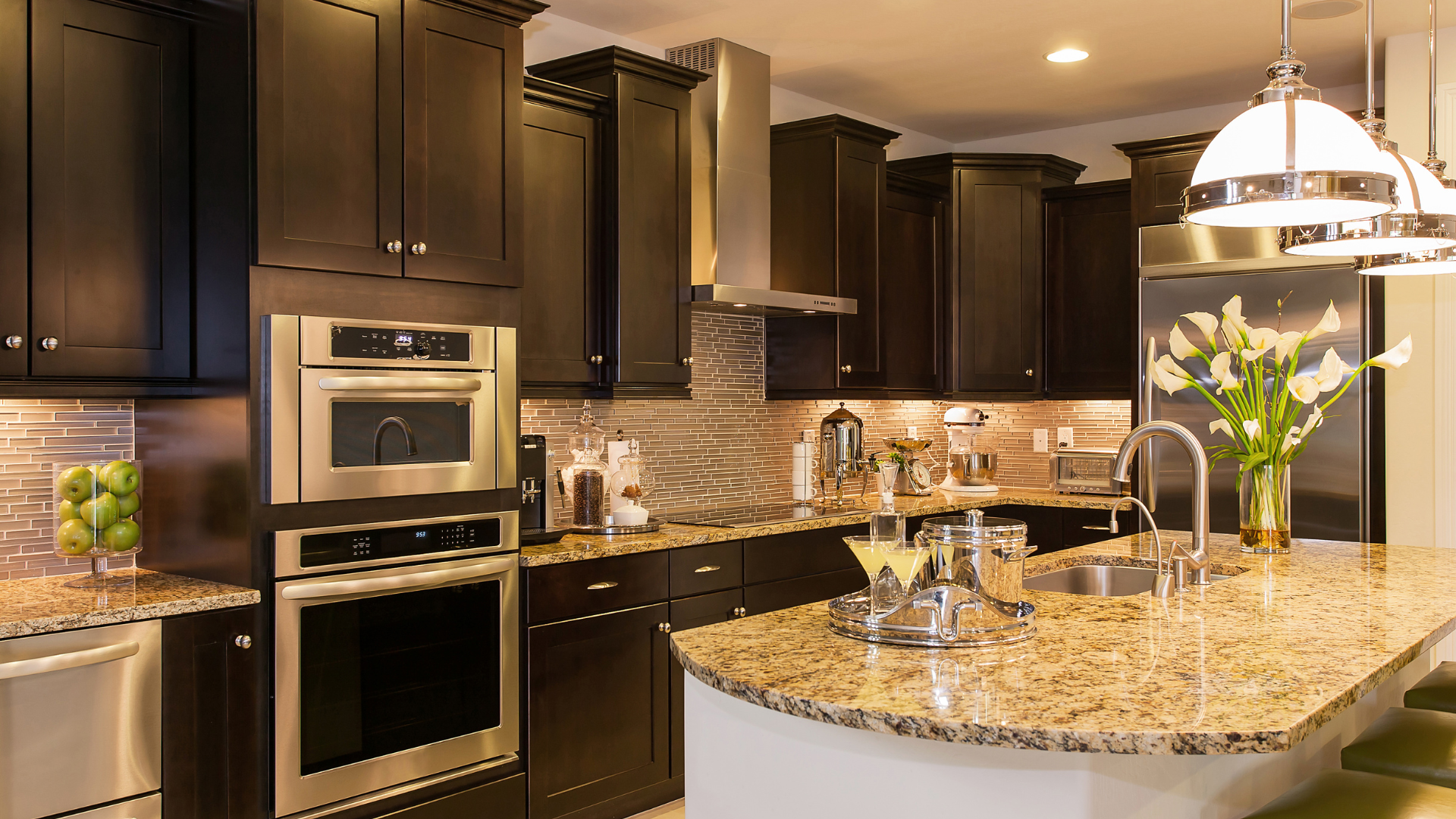 High-end kitchen remodel in Vacaville California with custom cabinetry quartz countertops and large island designed for everyday living