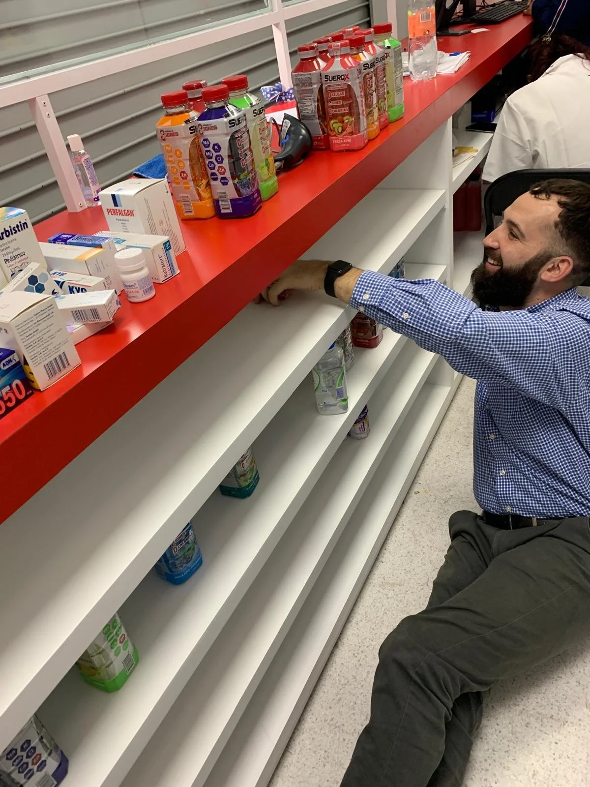 Kevin Lenahan working on pharmacy operations at Farmatuya.